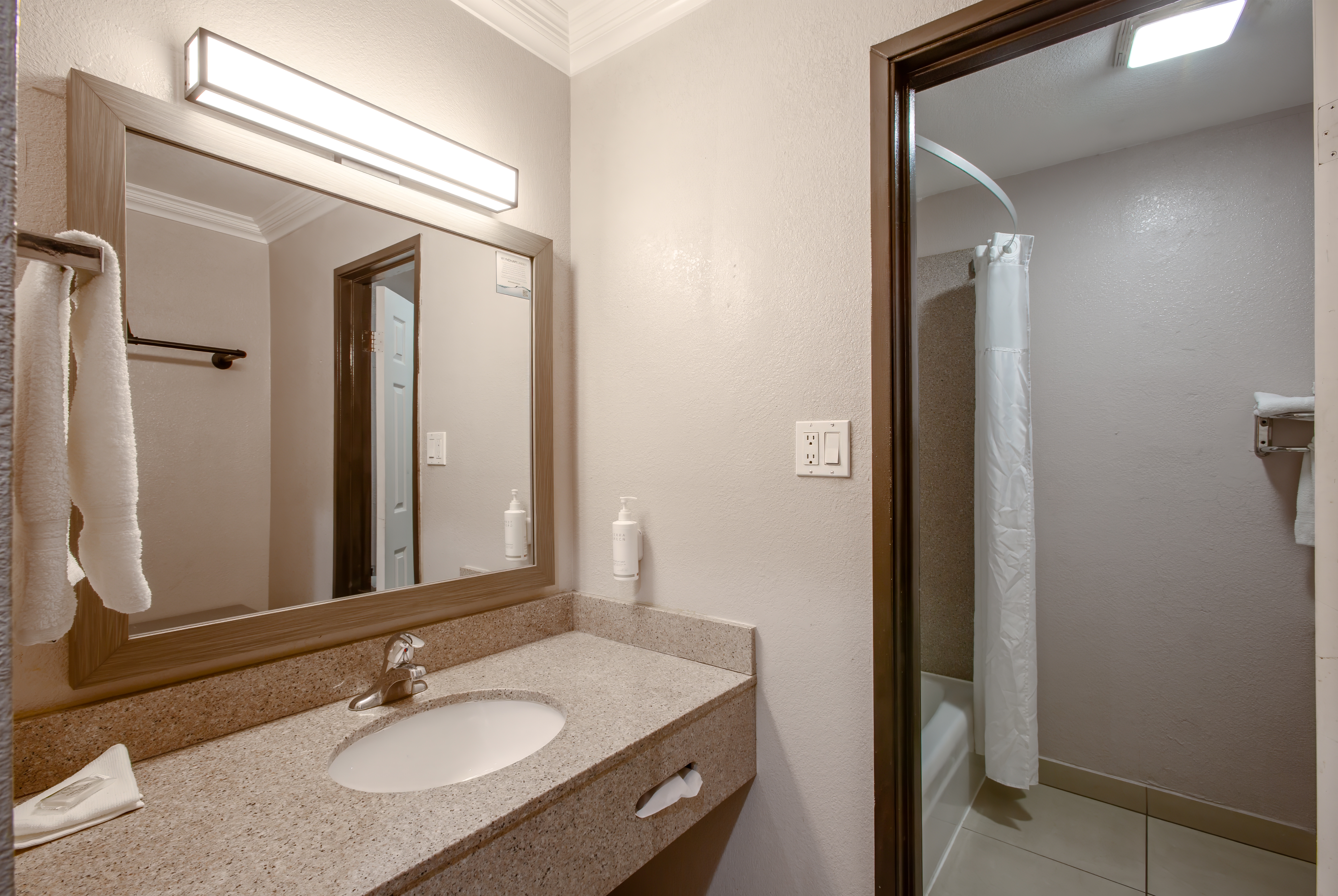 Guest room bath at the Super 8 by Wyndham Mesa Downtown Near Convention Center in Mesa, Arizona