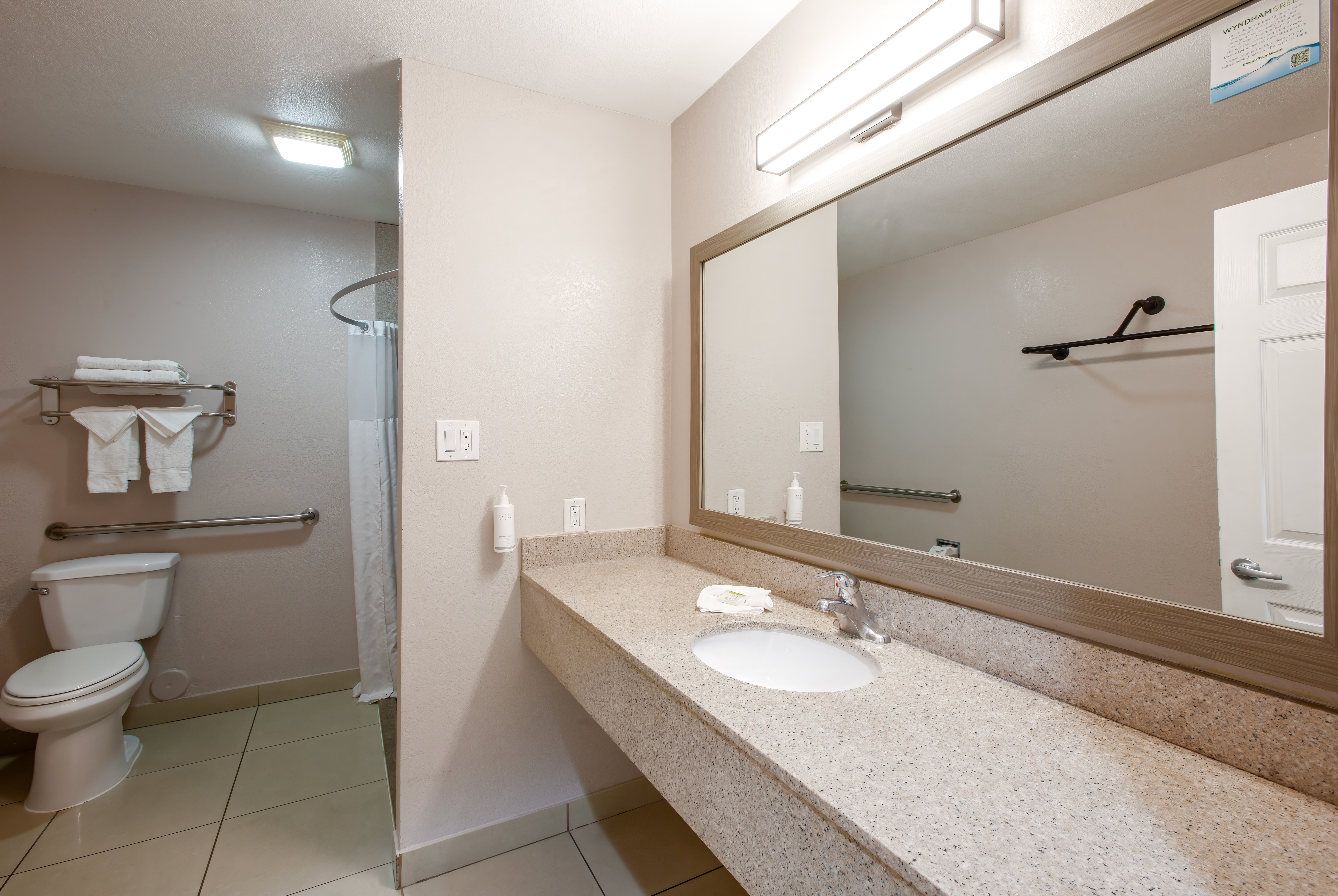 Guest room bath at the Super 8 by Wyndham Mesa Downtown Near Convention Center in Mesa, Arizona