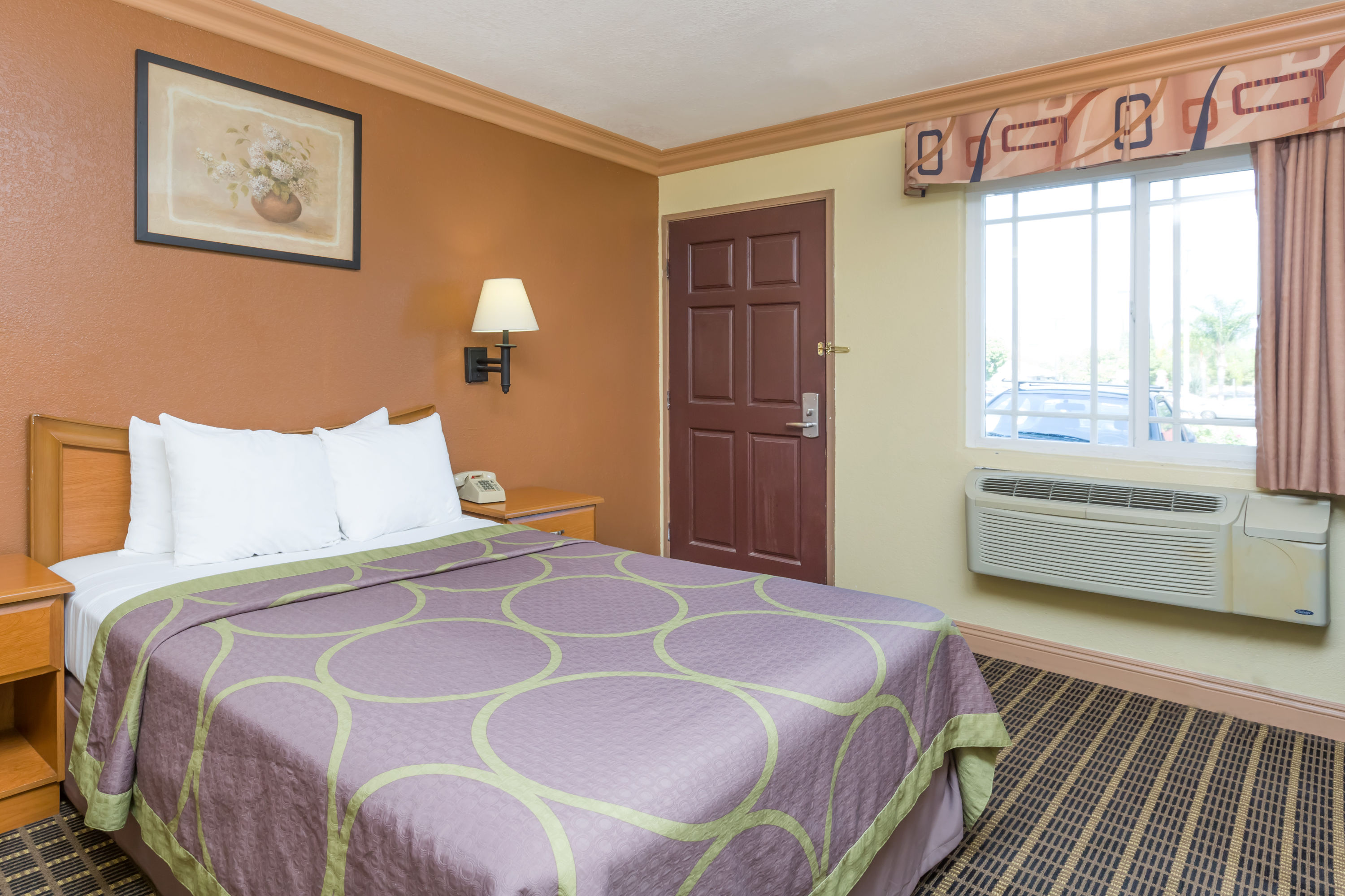 Guest room at the Super 8 by Wyndham Azusa in Azusa, California