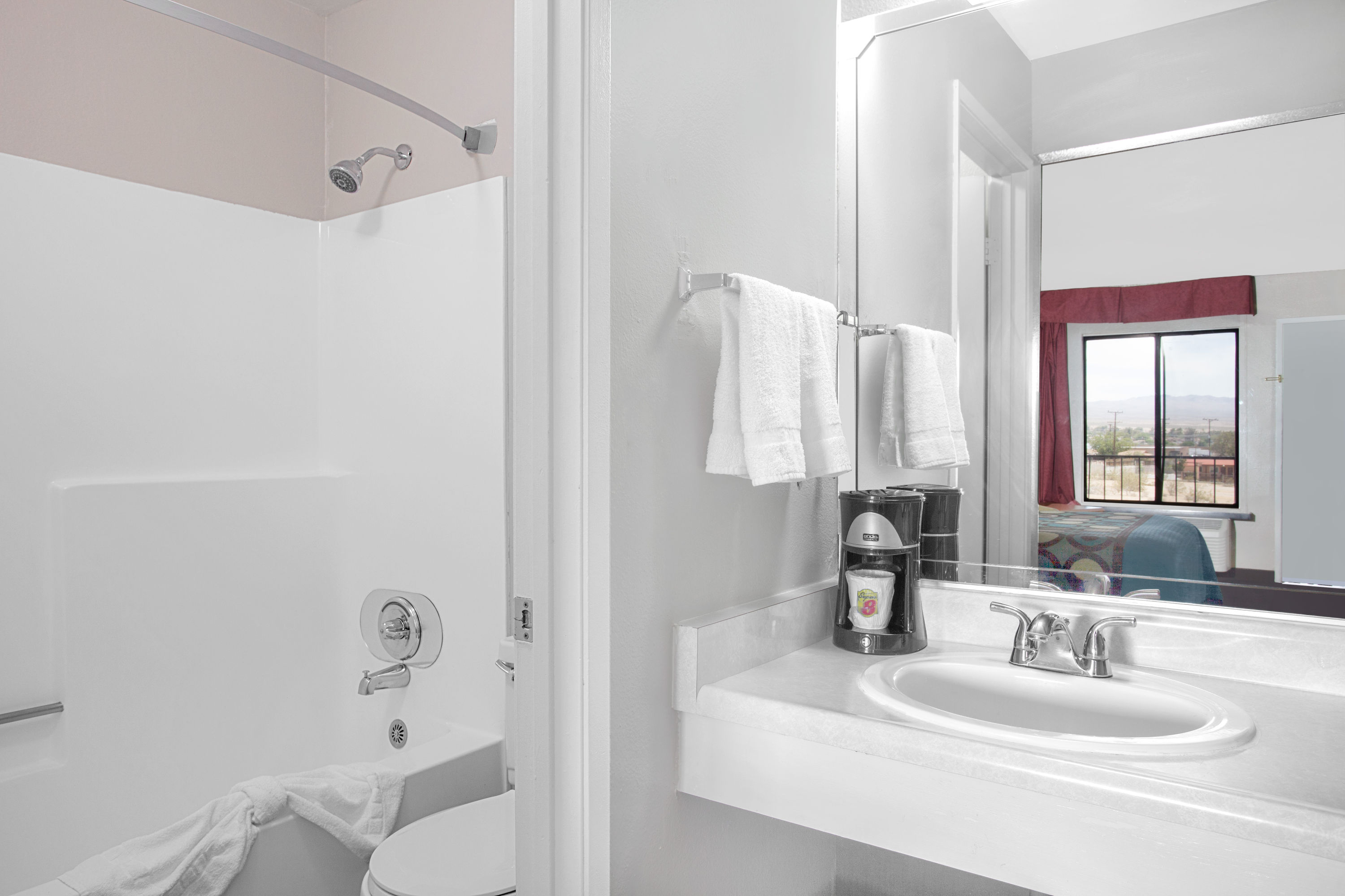 Guest room bath at the Super 8 by Wyndham Barstow in Barstow, California