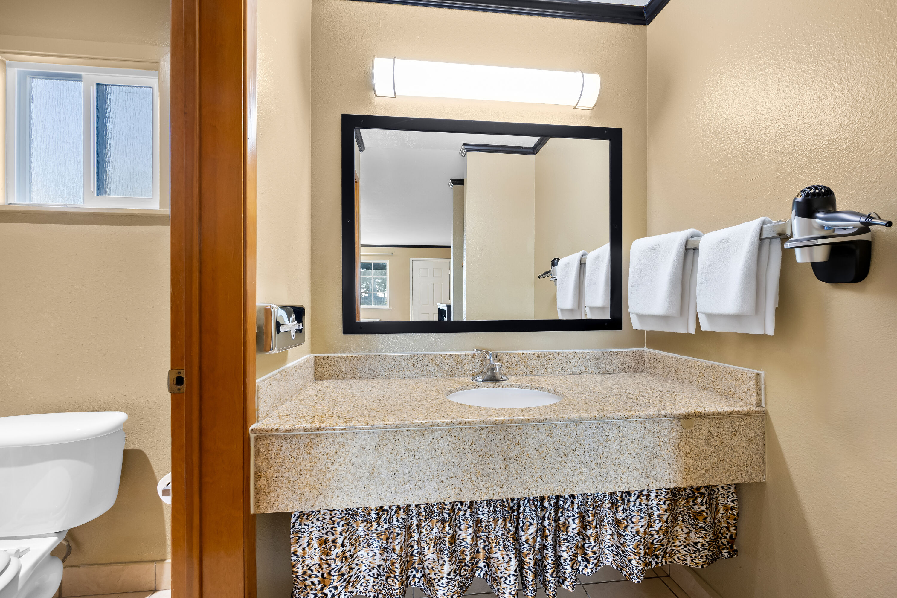 Guest room bath at the Super 8 by Wyndham Crescent City in Crescent City, California
