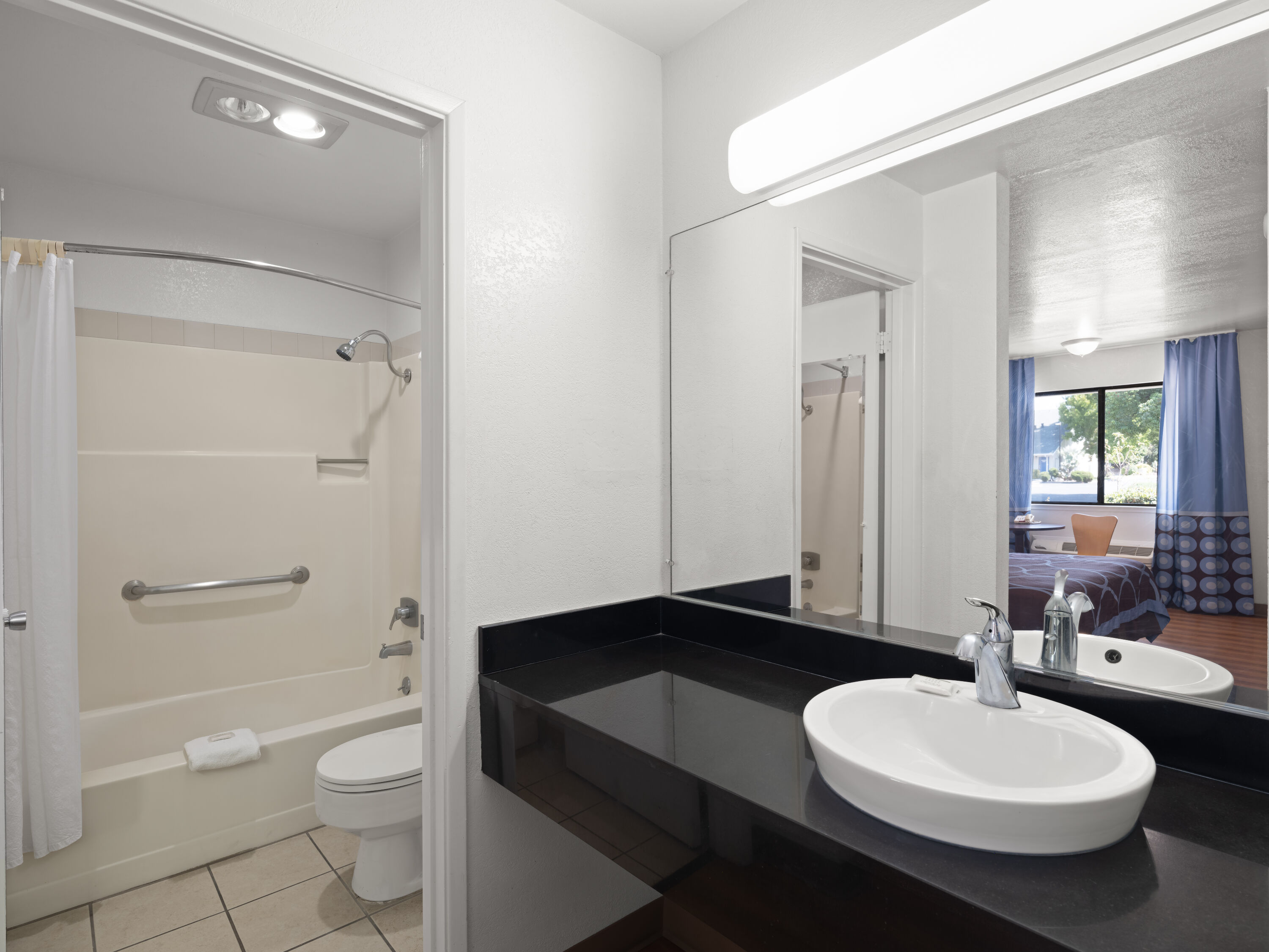 Guest room bath at the Super 8 by Wyndham Dunnigan in Dunnigan, California