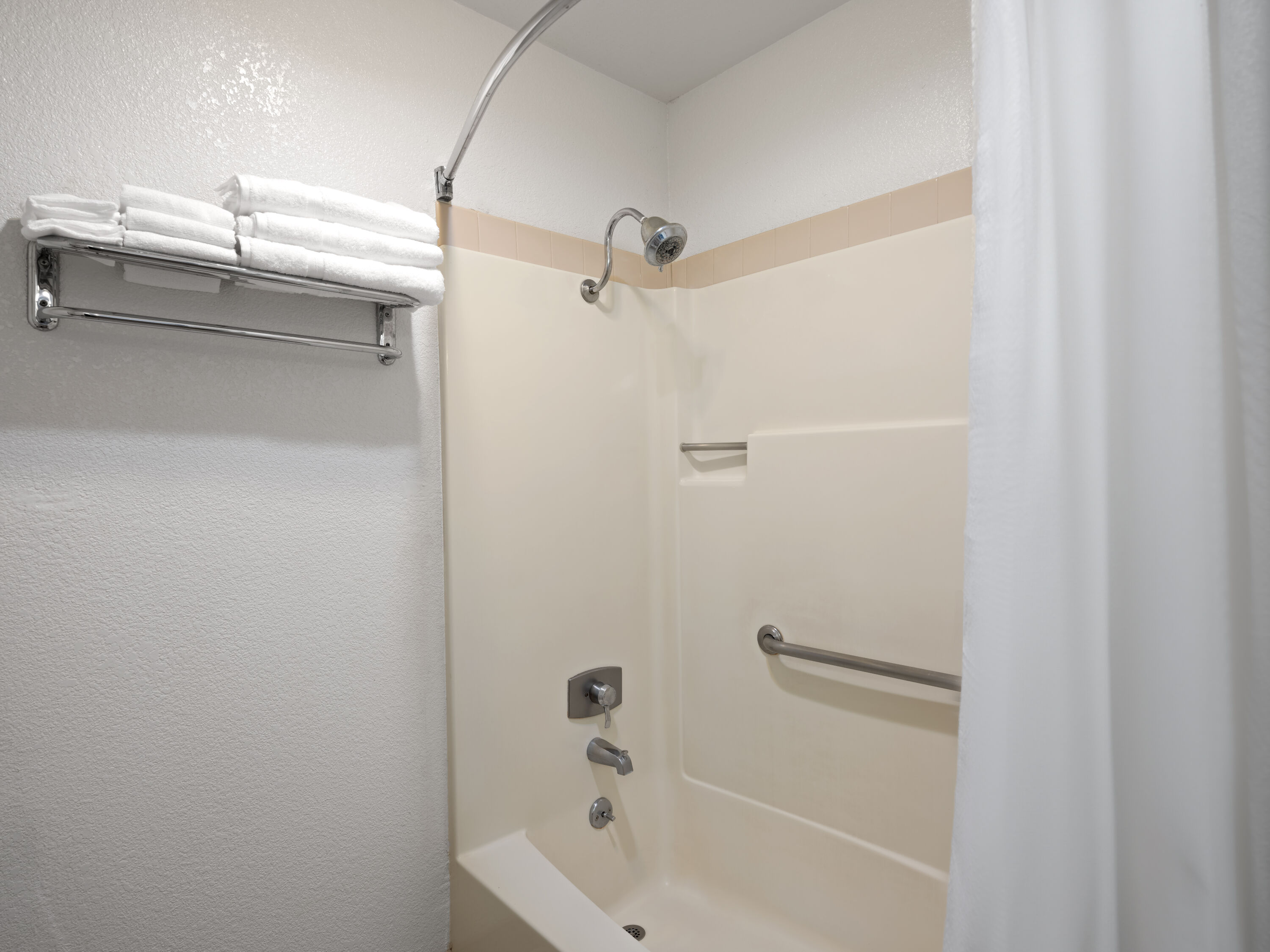 Guest room bath at the Super 8 by Wyndham Dunnigan in Dunnigan, California