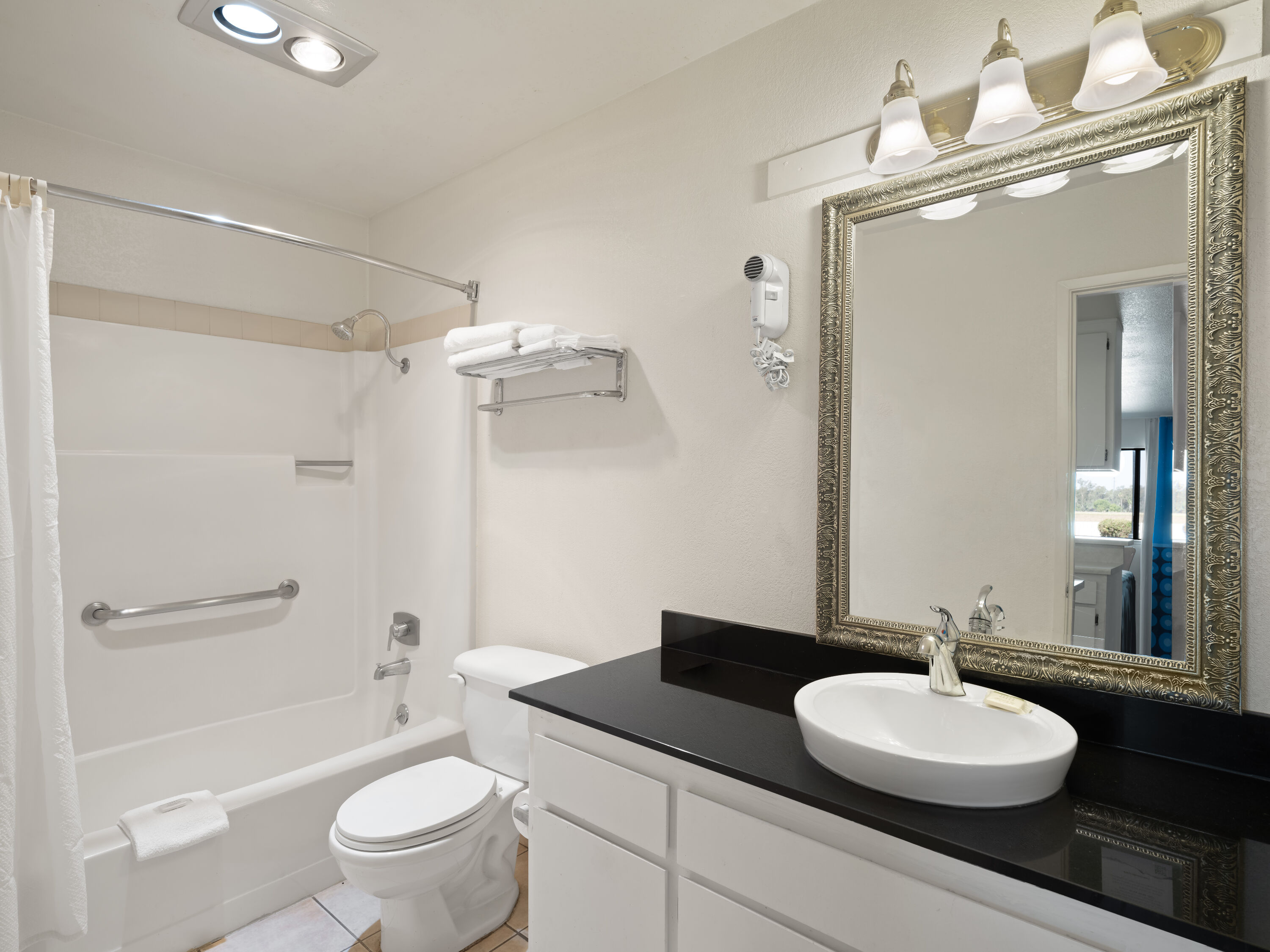 Guest room bath at the Super 8 by Wyndham Dunnigan in Dunnigan, California