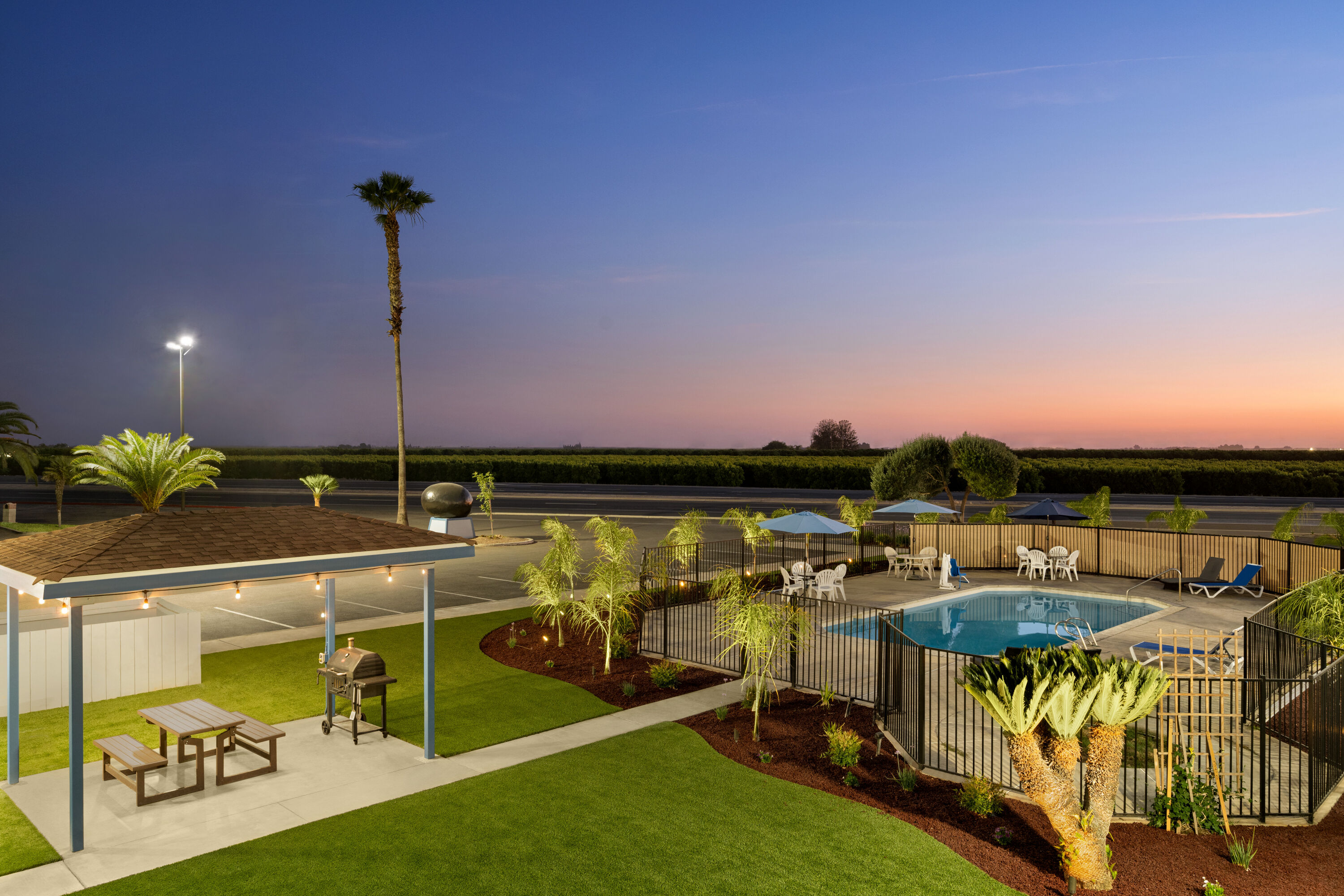 Family pool at the Super 8 by Wyndham Lindsay Olive Tree in Lindsay, California