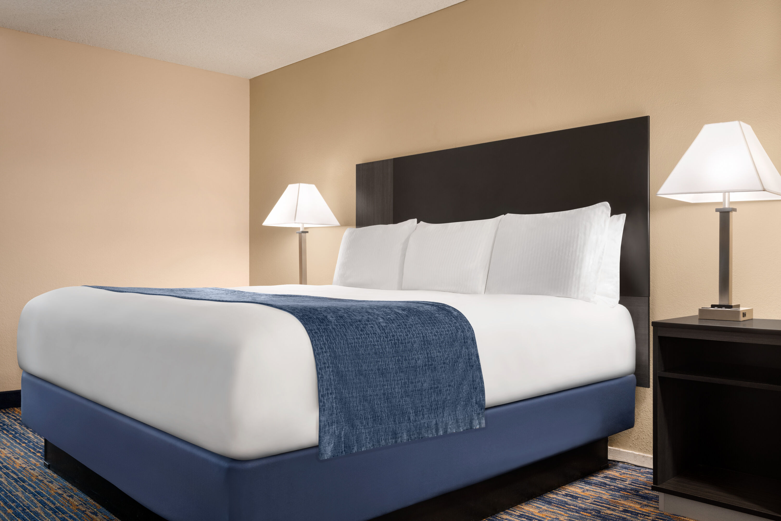 Guest room at the Super 8 by Wyndham Lindsay Olive Tree in Lindsay, California