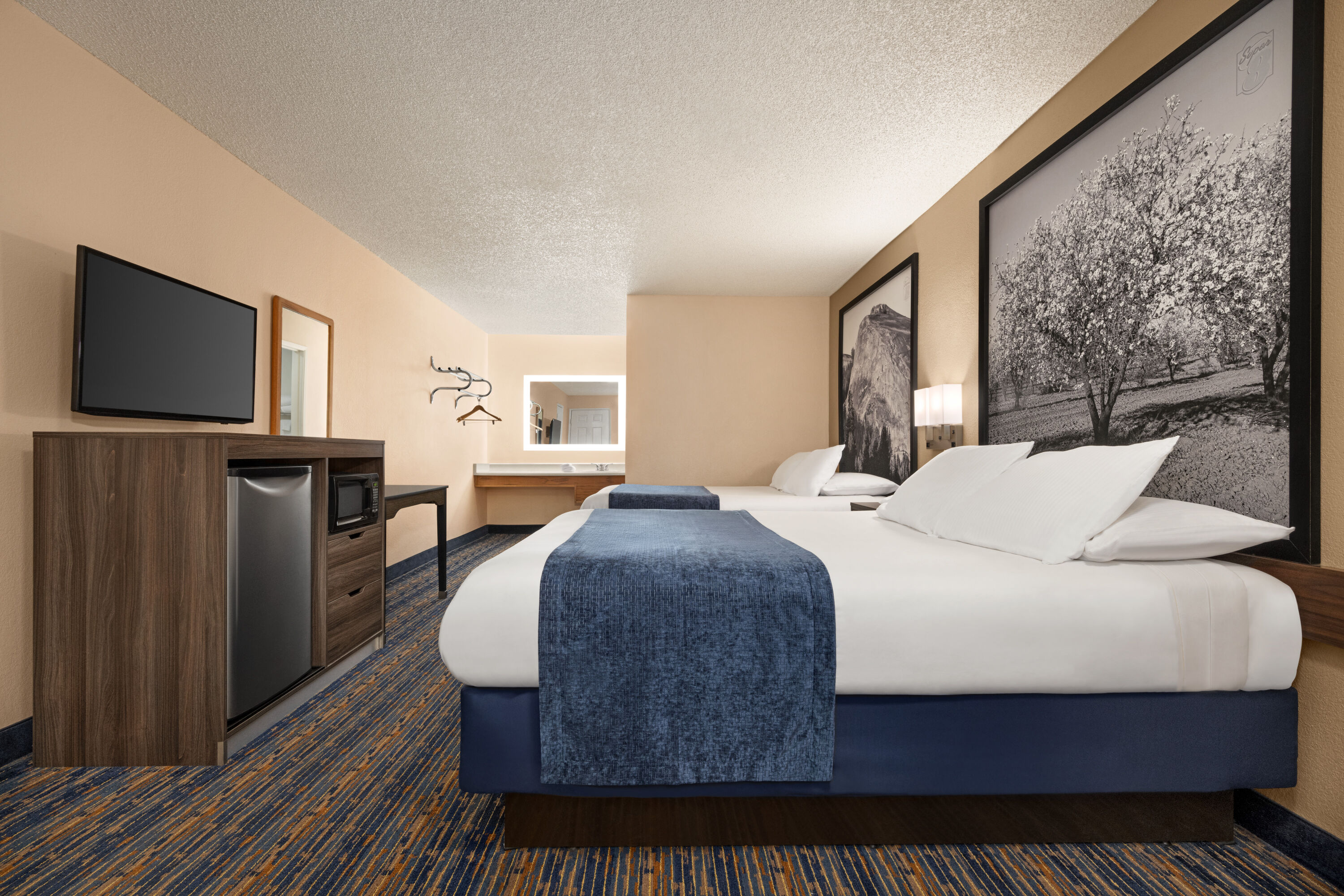 Guest room at the Super 8 by Wyndham Lindsay Olive Tree in Lindsay, California