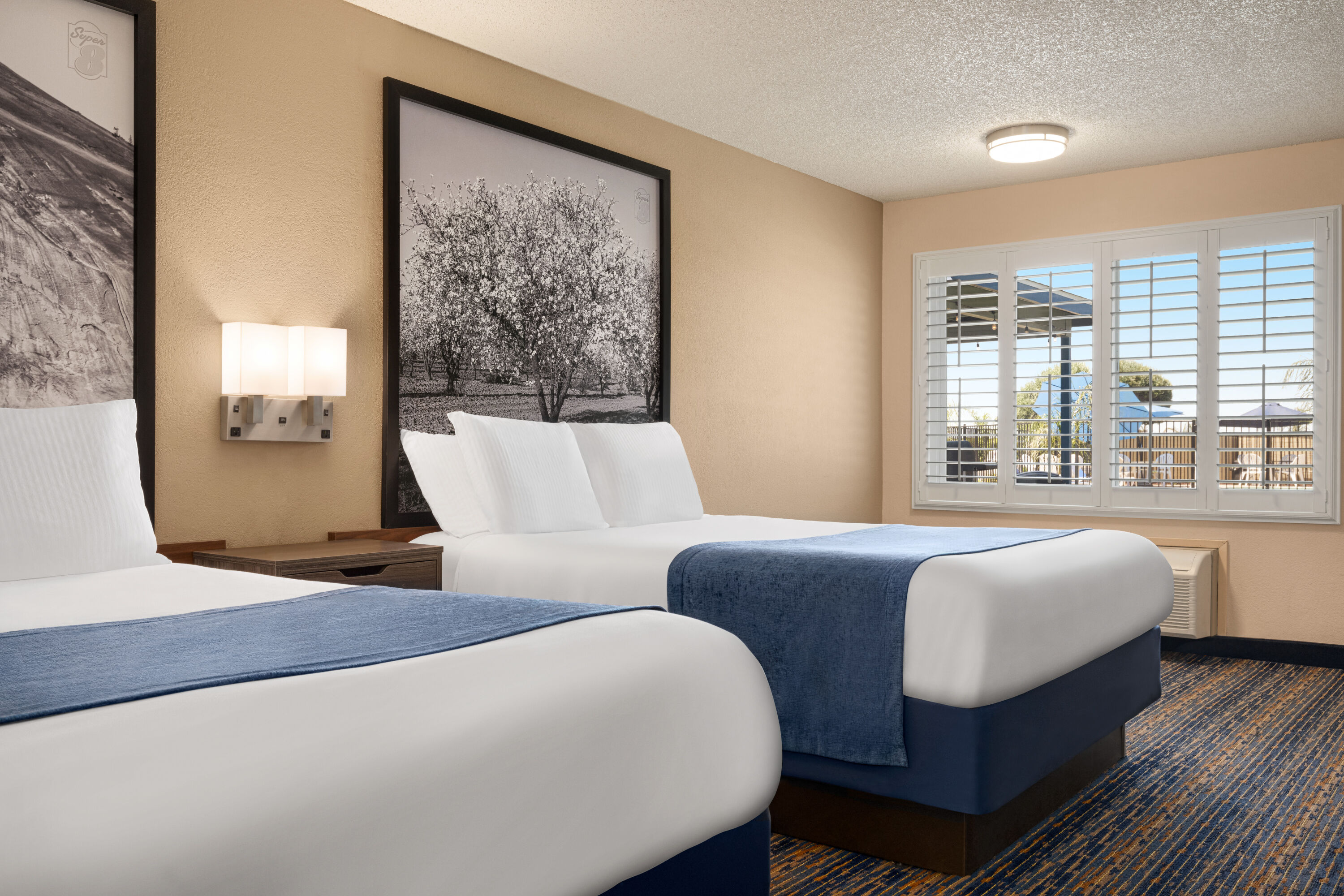 Guest room at the Super 8 by Wyndham Lindsay Olive Tree in Lindsay, California