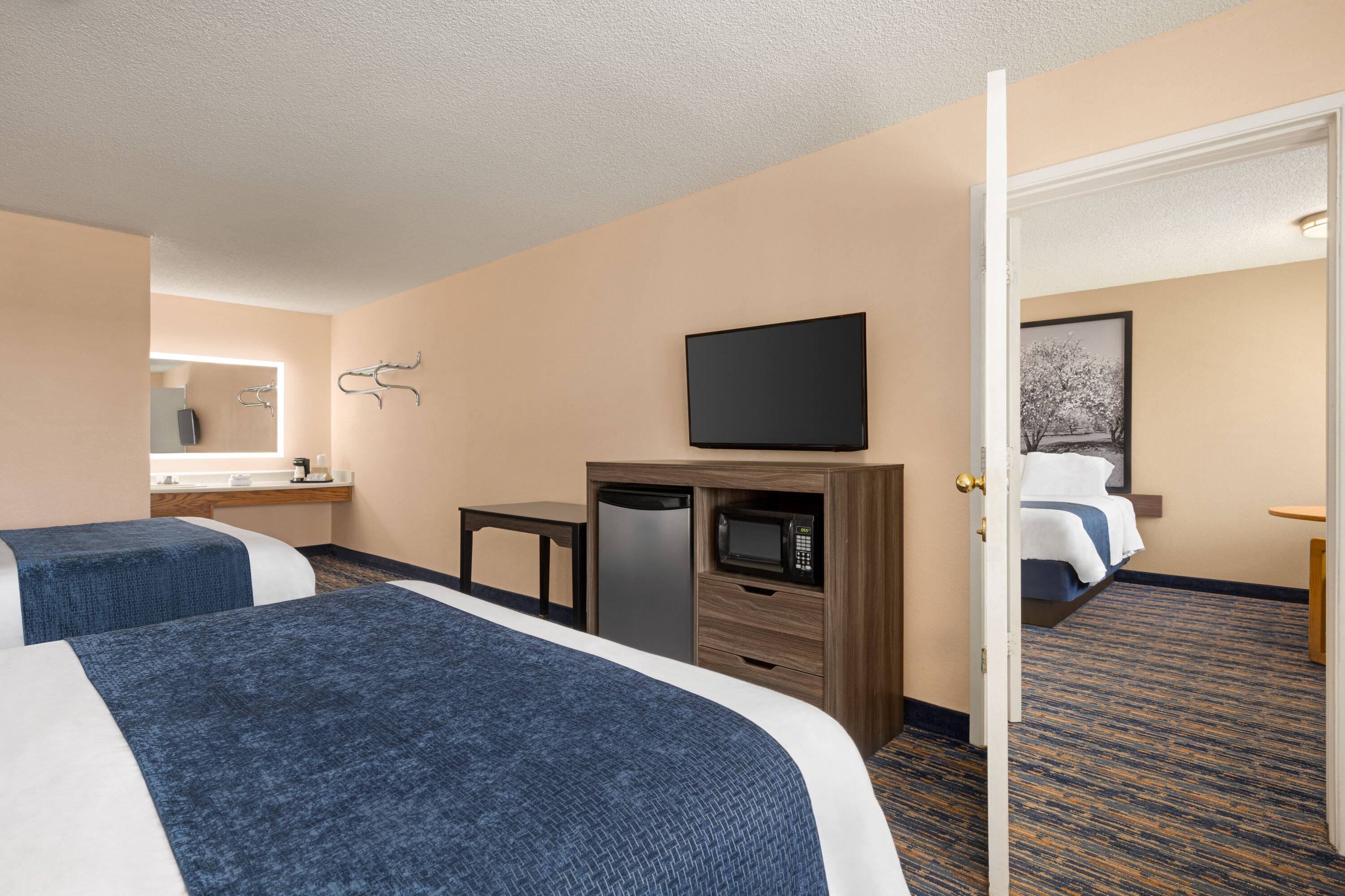 Guest room at the Super 8 by Wyndham Lindsay Olive Tree in Lindsay, California