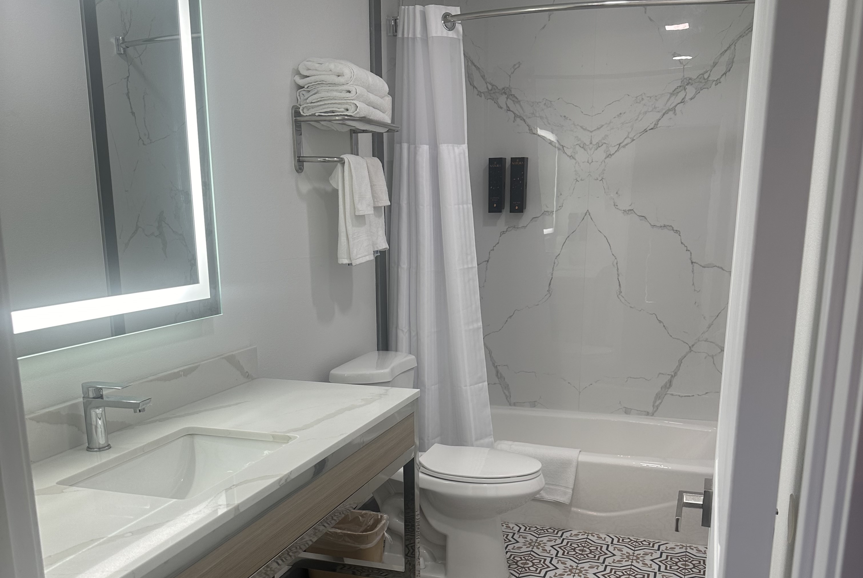 Guest room bath at the Super 8 by Wyndham Oceanside Downtown in Oceanside, California