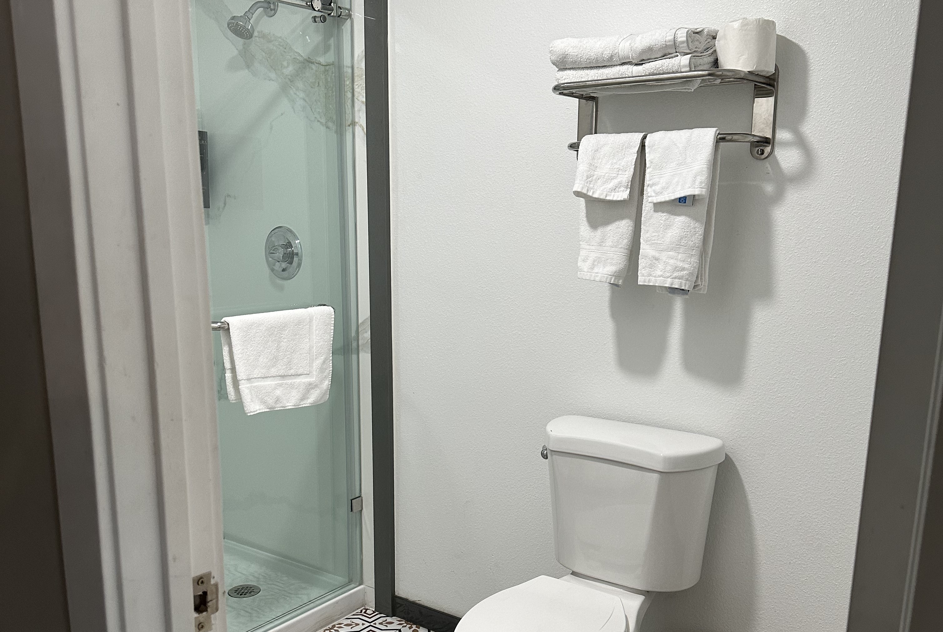 Guest room bath at the Super 8 by Wyndham Oceanside Downtown in Oceanside, California