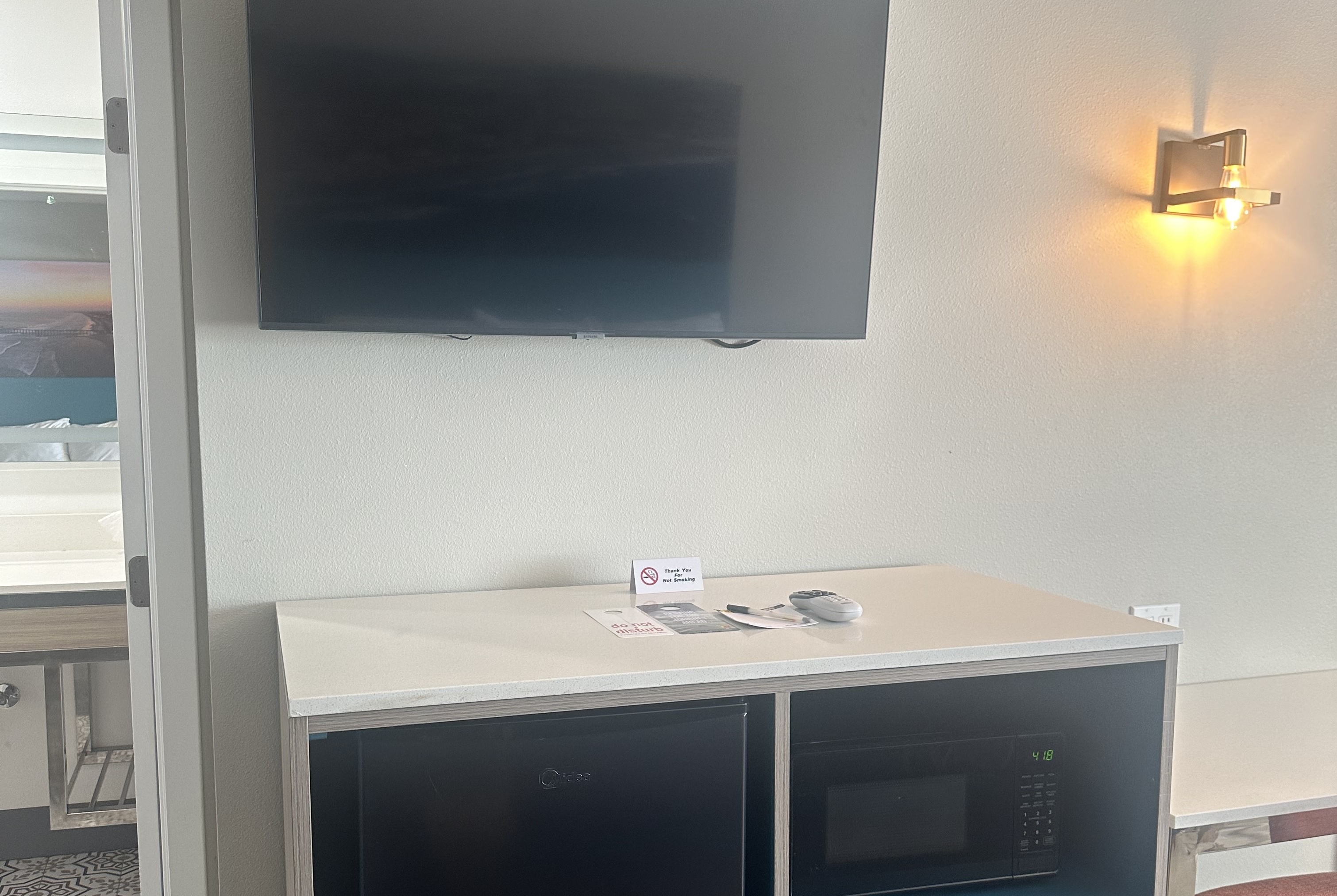 Guest room at the Super 8 by Wyndham Oceanside Downtown in Oceanside, California