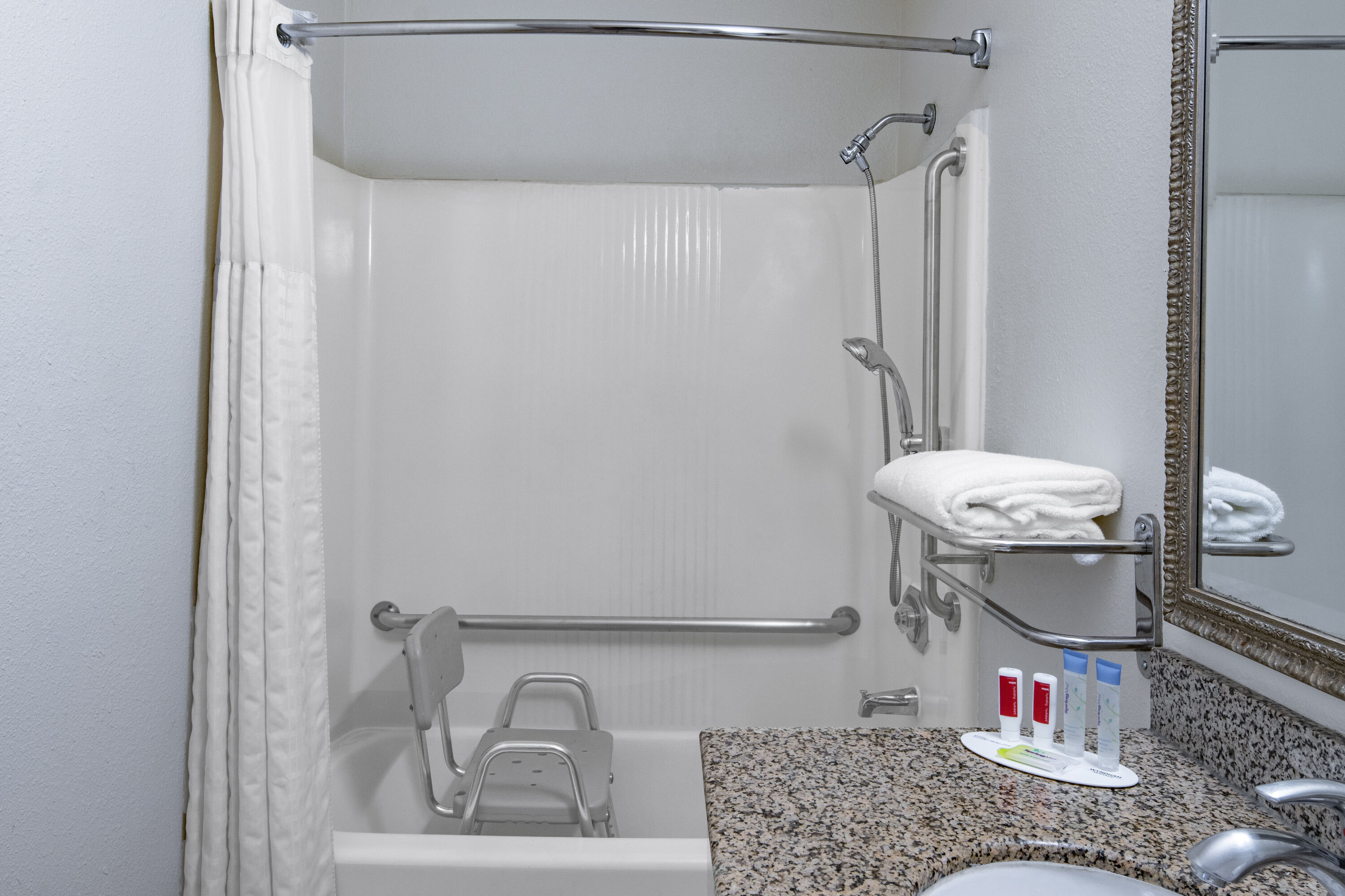 Guest room bath at the Super 8 by Wyndham San Diego Hotel Circle in San Diego, California