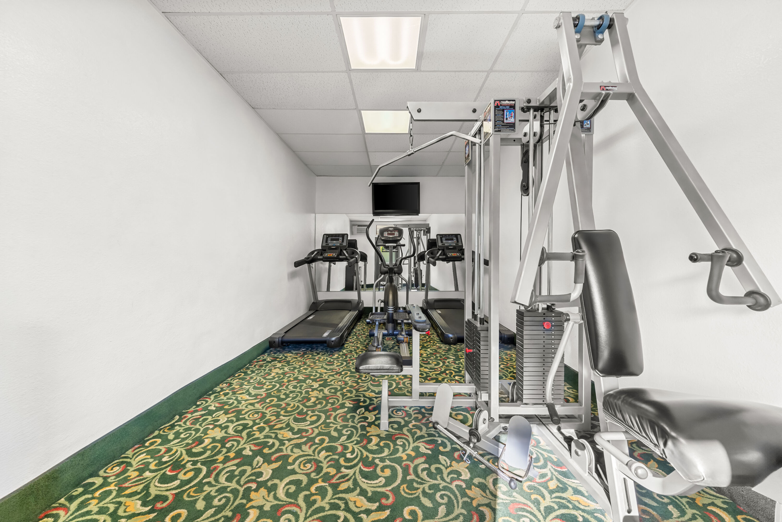Fitness room at Super 8 by Wyndham San Diego Hotel Circle in San Diego, California