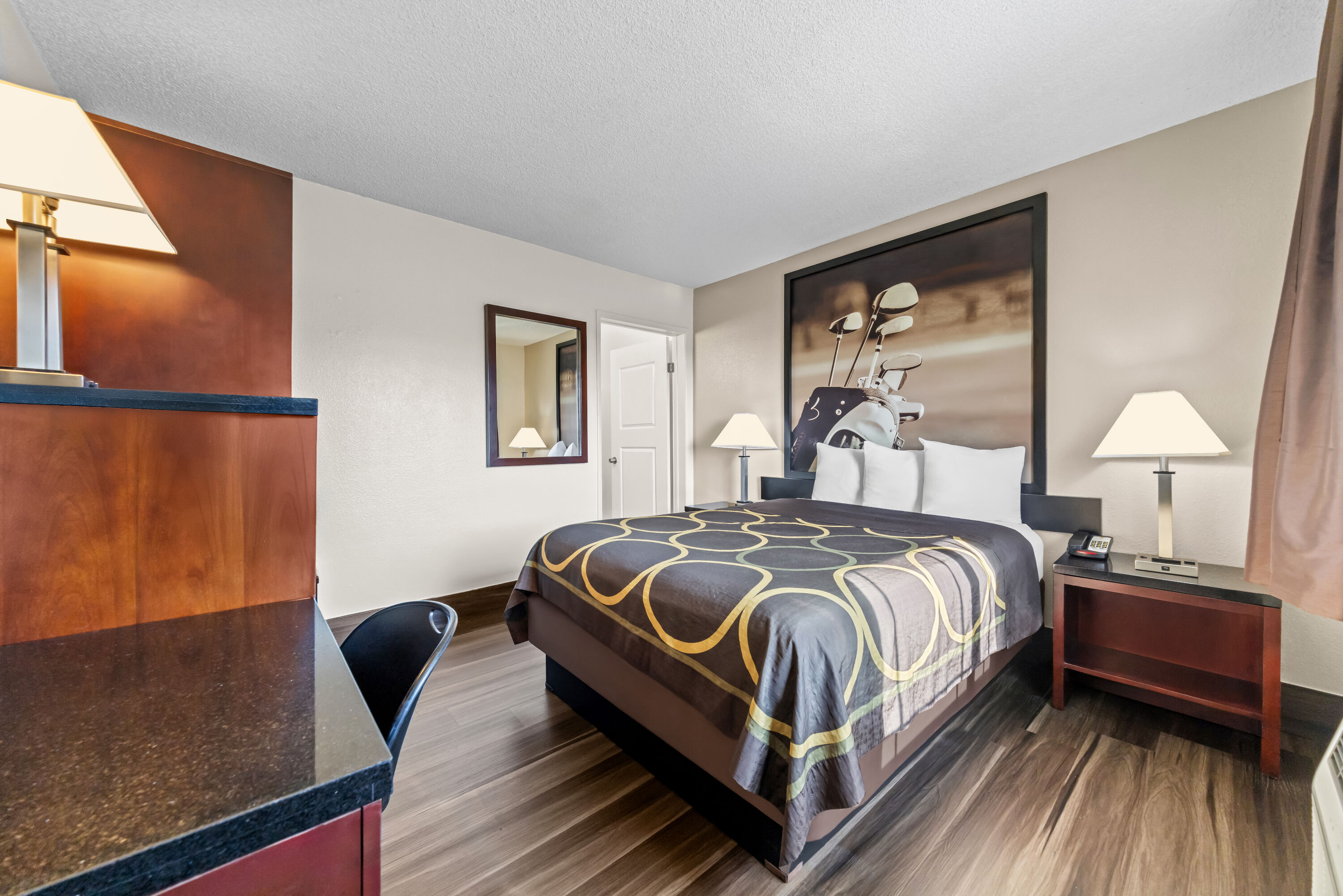 Queen bed guest room at the Super 8 by Wyndham San Diego Hotel Circle in San Diego, California