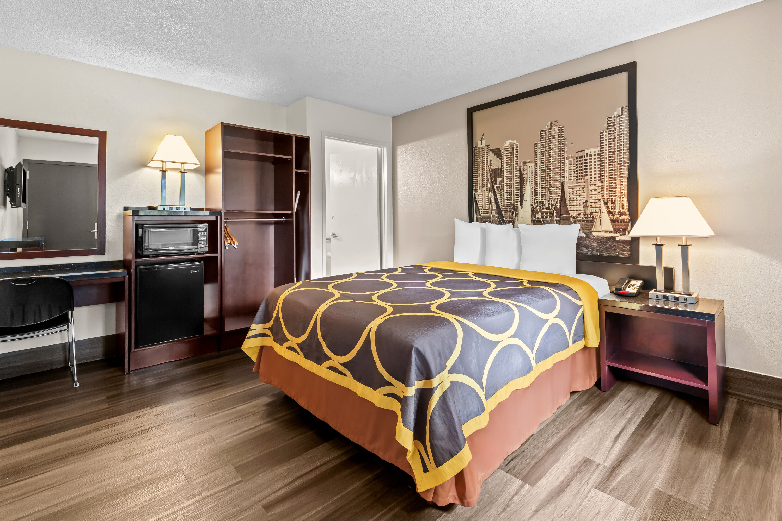 Queen bed guest room at the Super 8 by Wyndham San Diego Hotel Circle in San Diego, California