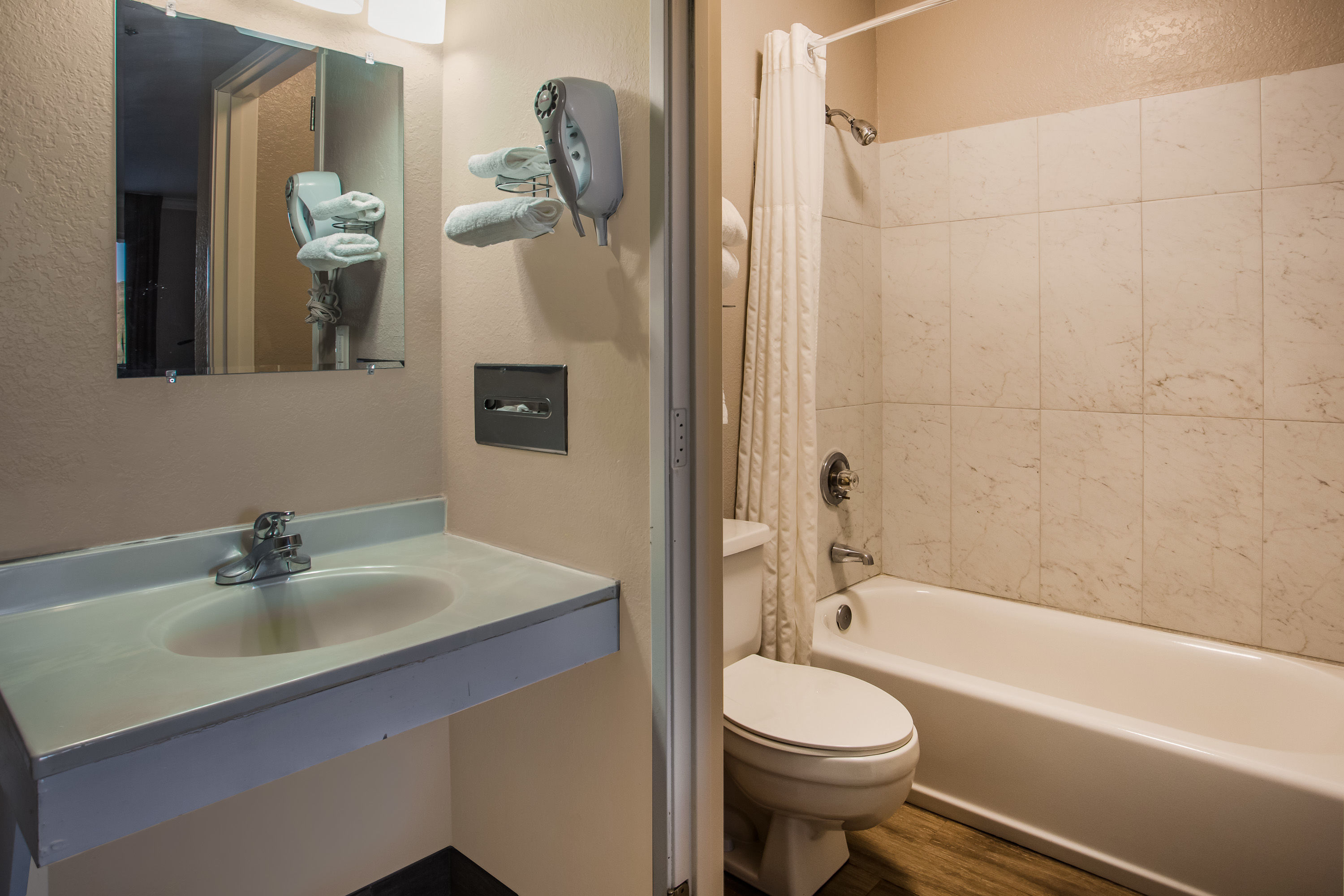 Guest room bath at the Super 8 by Wyndham Vacaville in Vacaville, California
