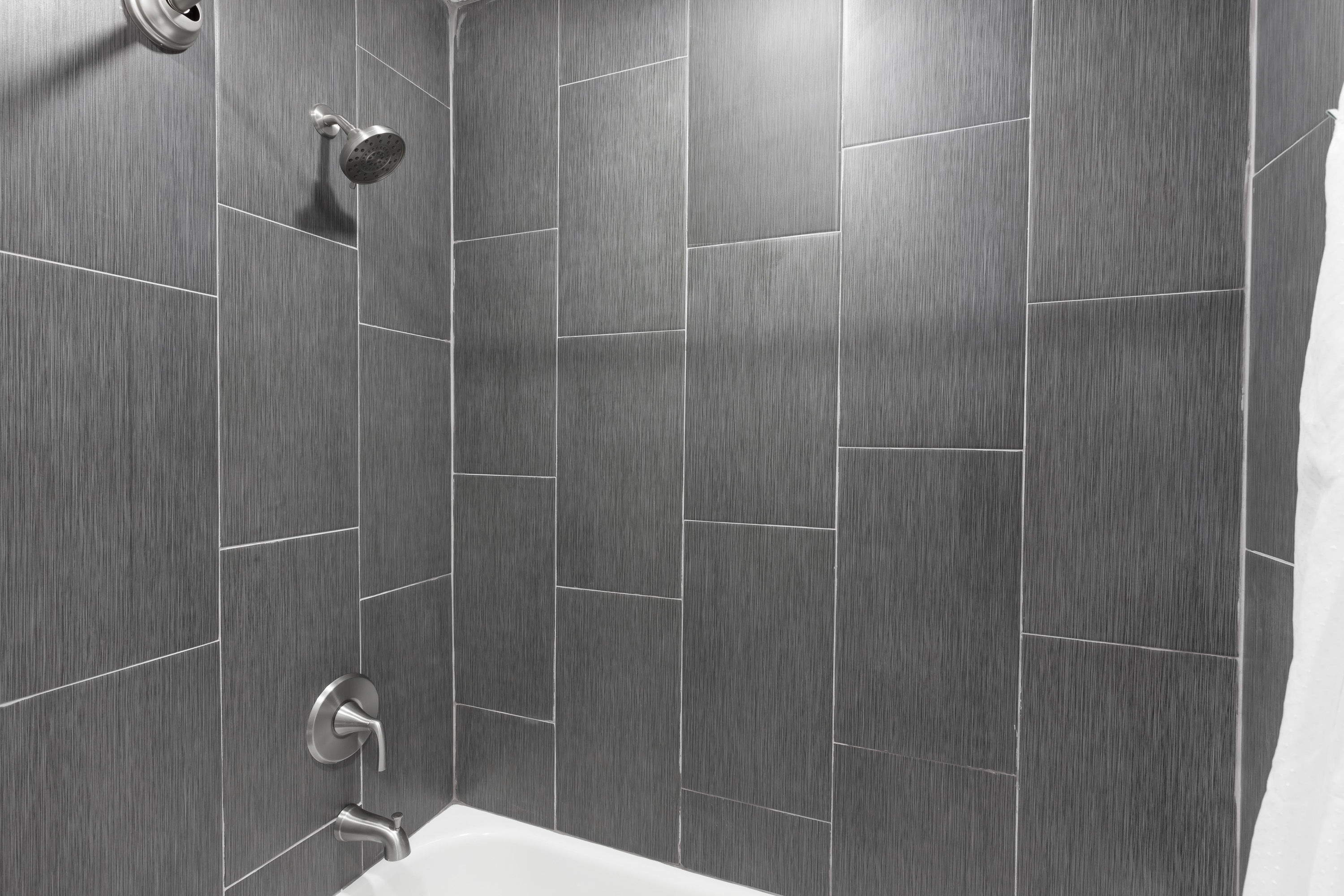 Guest room bath at the Super 8 by Wyndham Visalia in Visalia, California