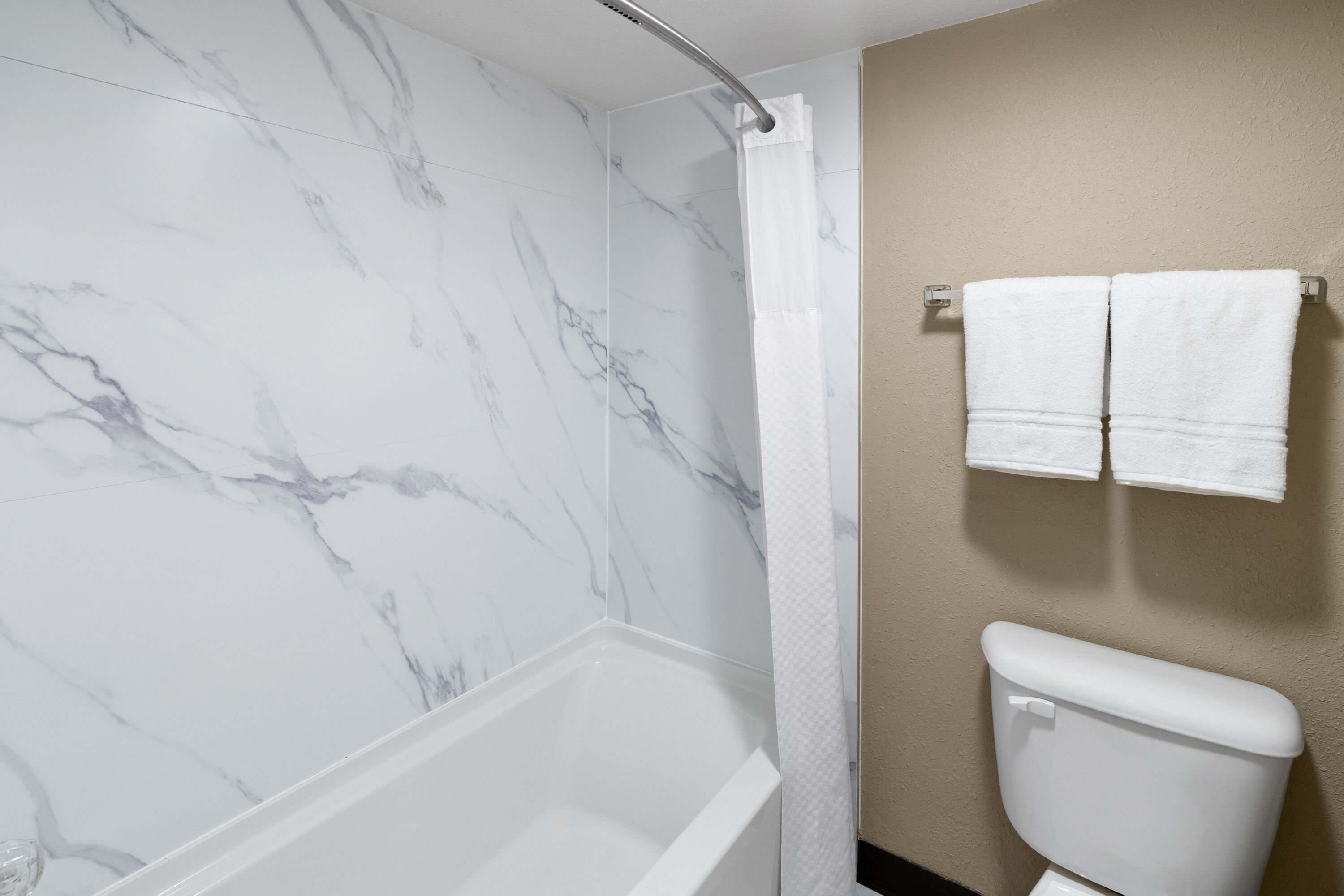 Guest room bath at the Super 8 by Wyndham Colo. Sprs. Garden Of The Gods in Colorado Springs, Colorado