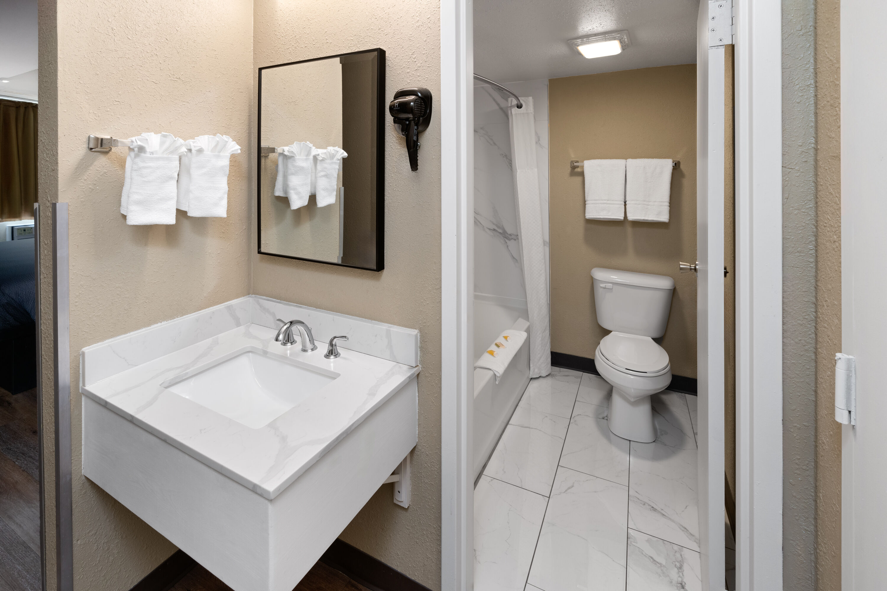 Guest room bath at the Super 8 by Wyndham Colo. Sprs. Garden Of The Gods in Colorado Springs, Colorado