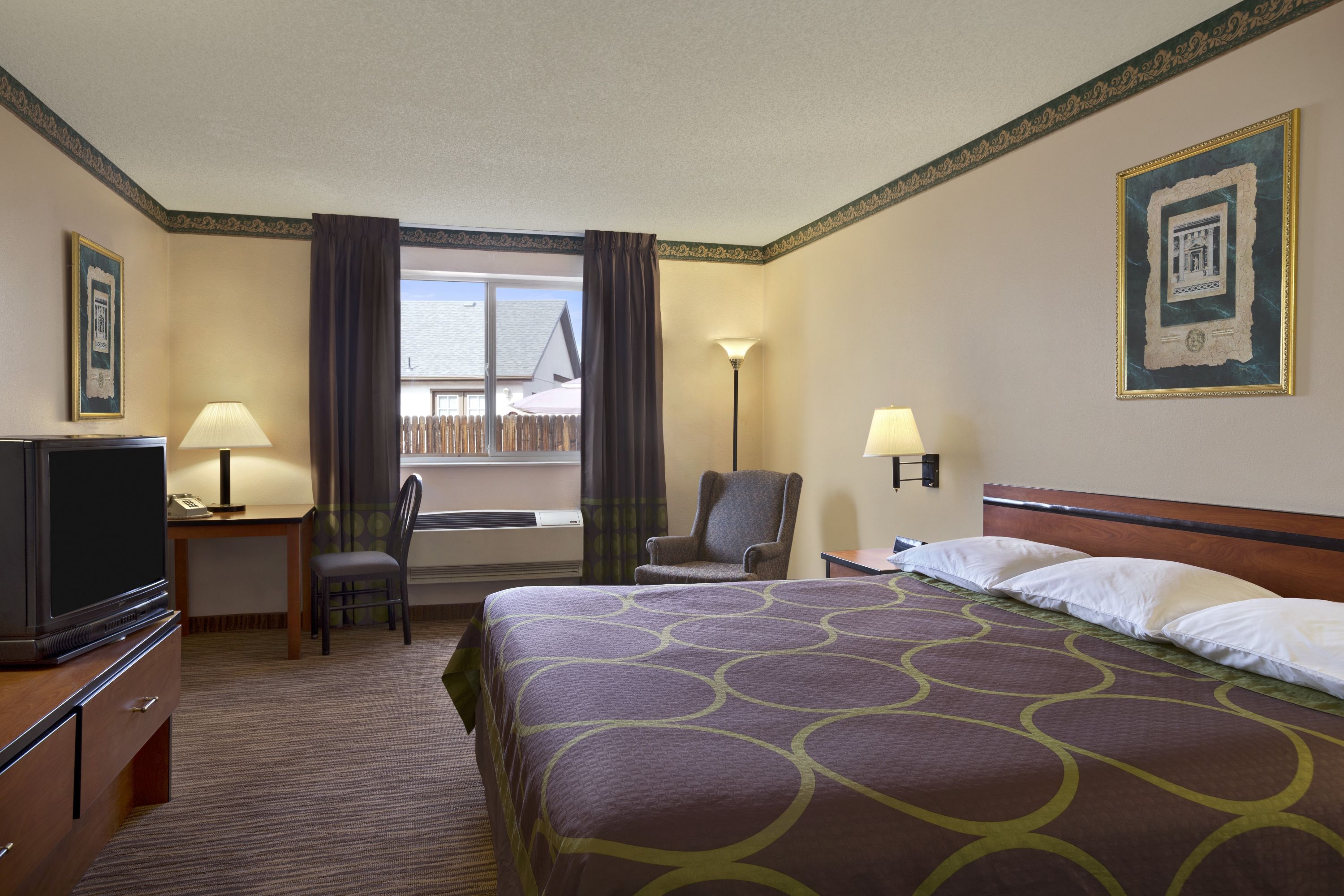 Guest room at the Super 8 by Wyndham Colorado Springs Airport in Colorado Springs, Colorado