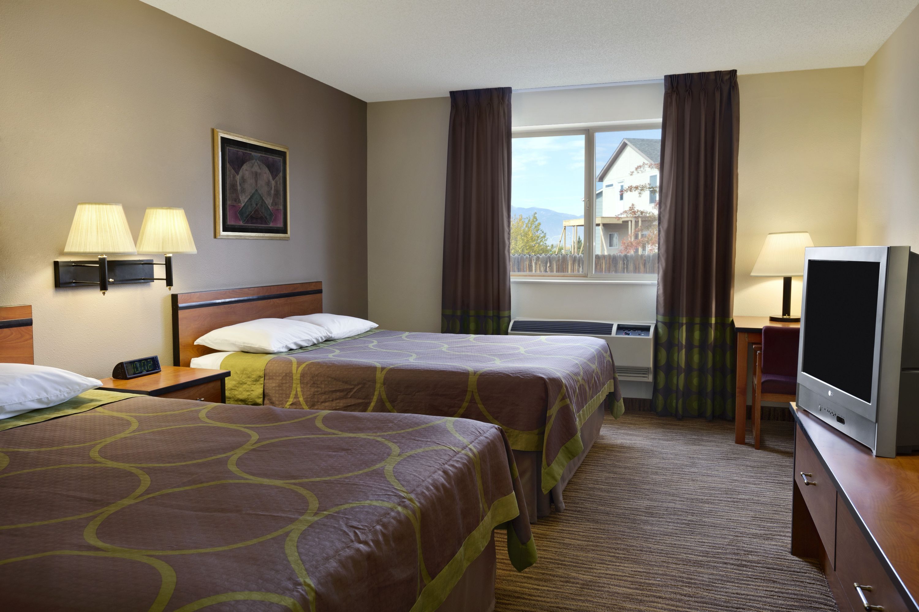 Guest room at the Super 8 by Wyndham Colorado Springs Airport in Colorado Springs, Colorado