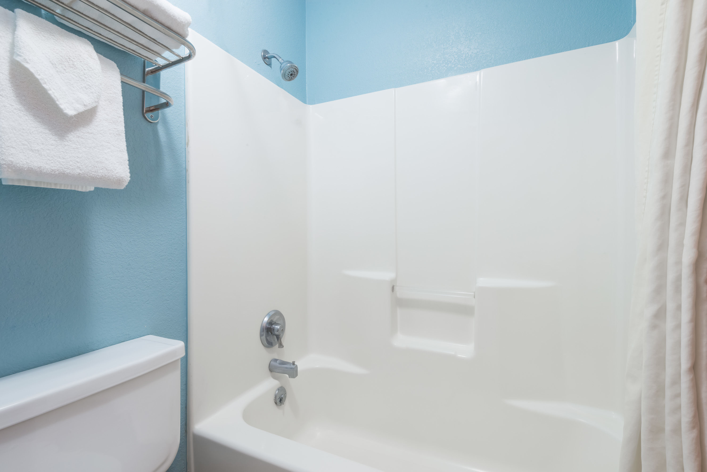 Guest room bath at the Super 8 by Wyndham Henderson North East Denver in Henderson, Colorado