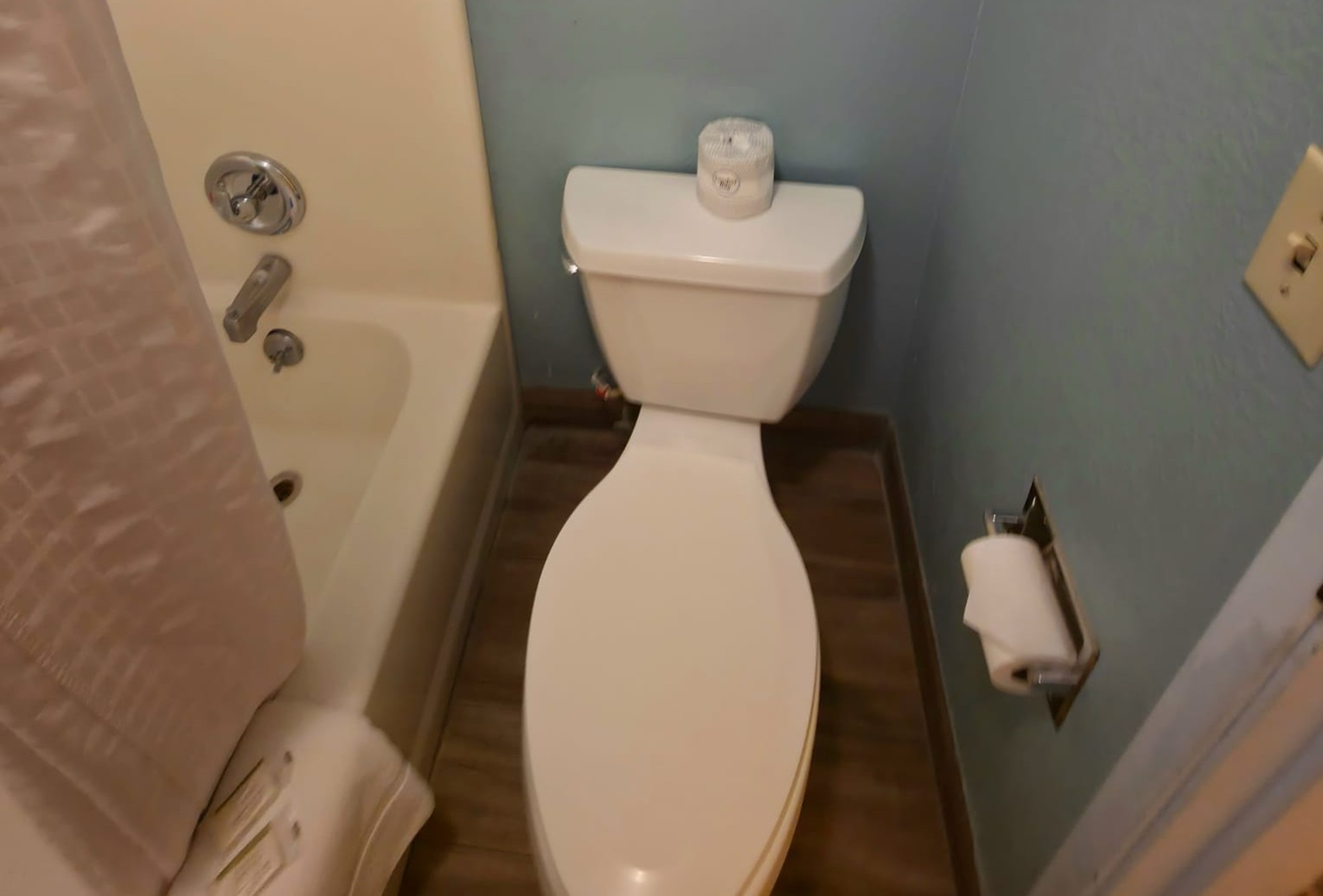 Guest room bath at the Super 8 by Wyndham Henderson North East Denver in Henderson, Colorado