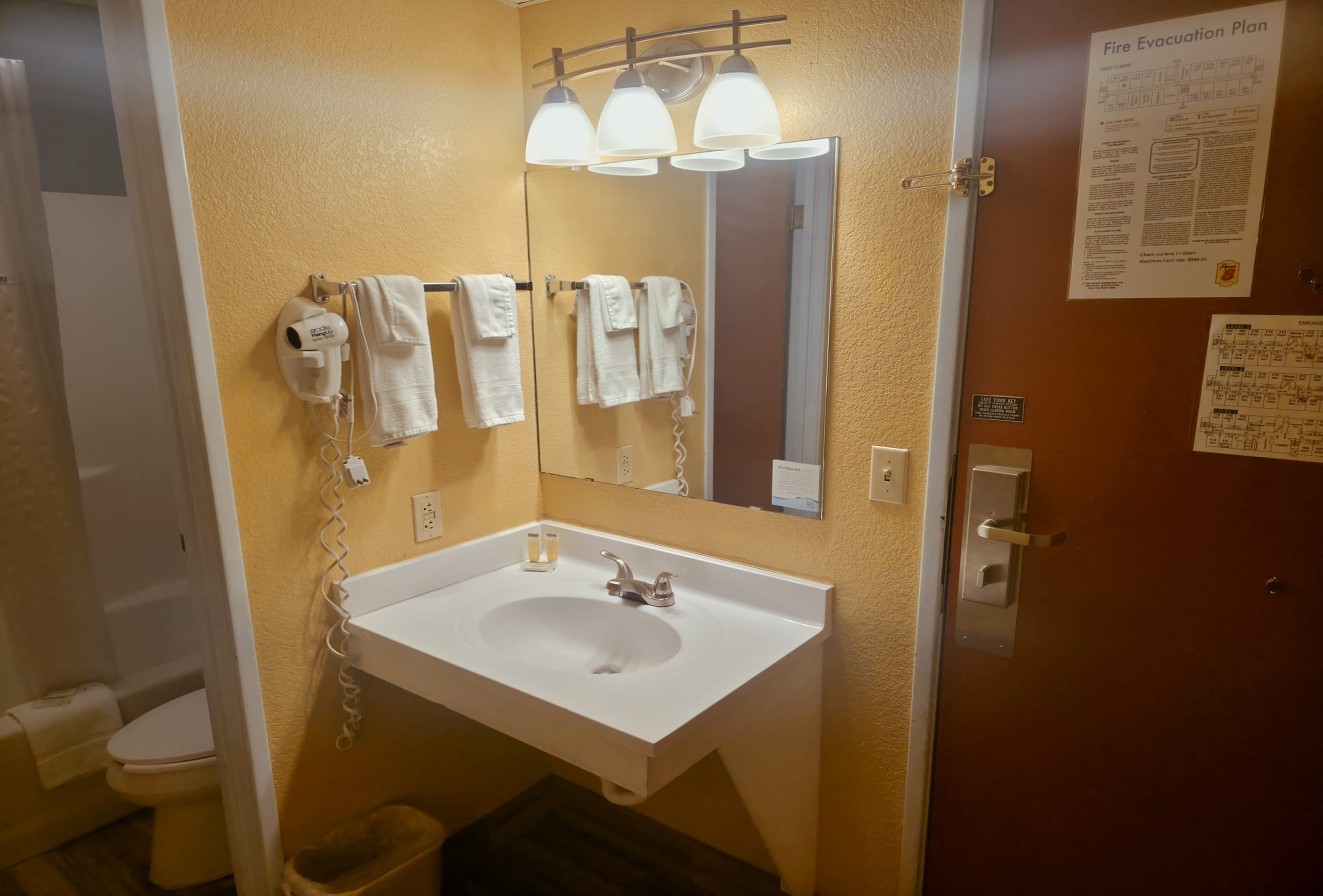 Guest room bath at the Super 8 by Wyndham Henderson North East Denver in Henderson, Colorado