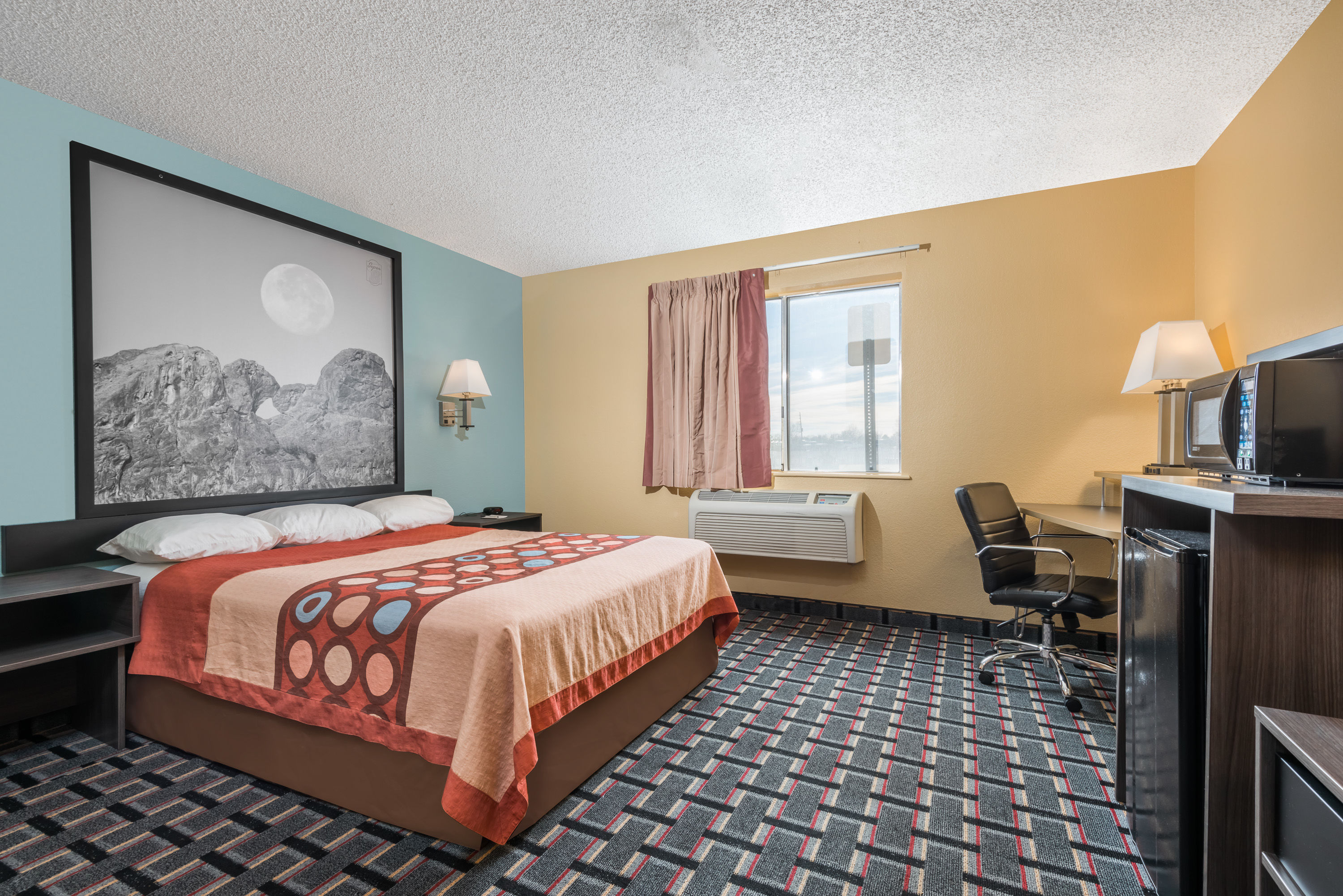 Guest room at the Super 8 by Wyndham Henderson North East Denver in Henderson, Colorado
