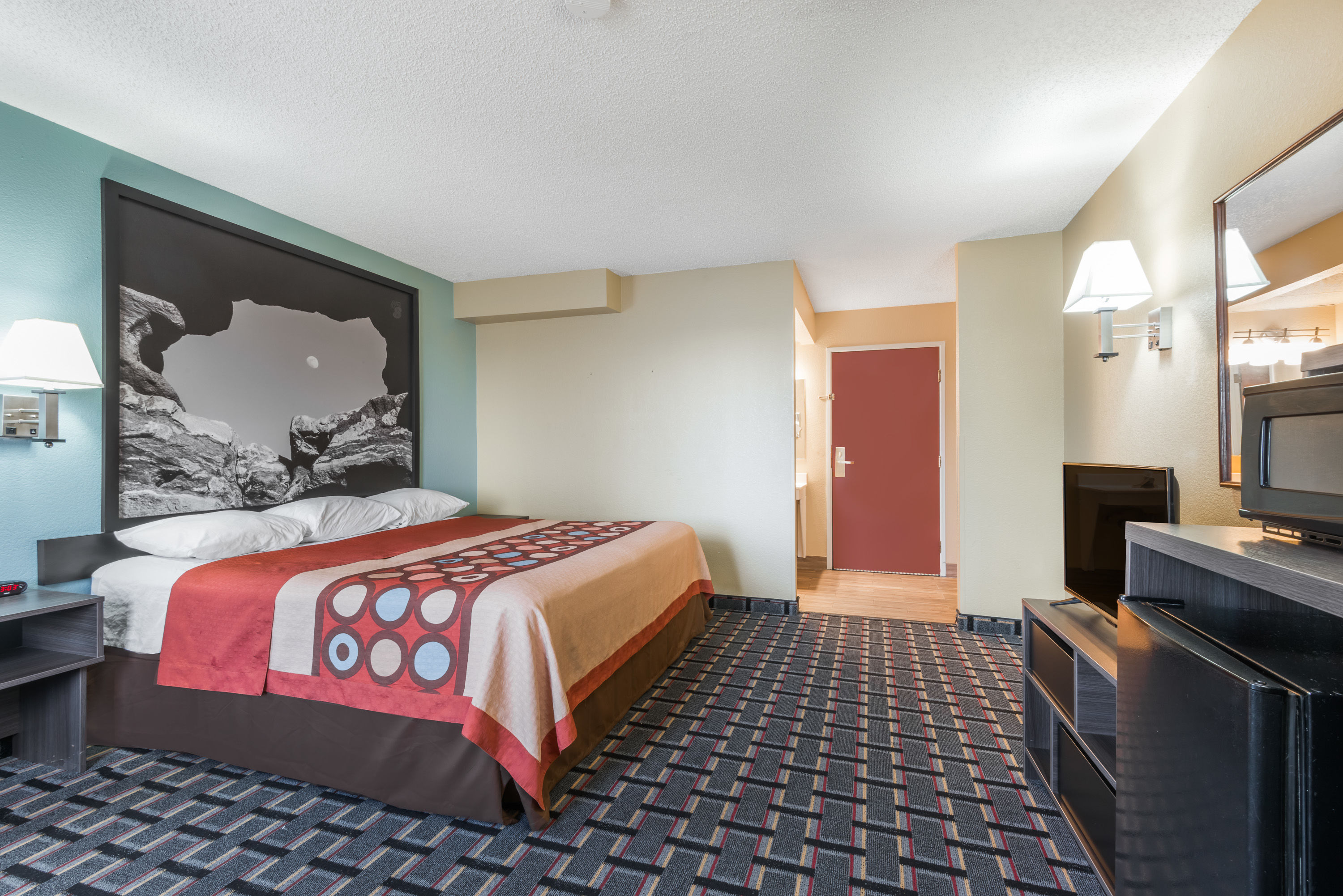 Guest room at the Super 8 by Wyndham Henderson North East Denver in Henderson, Colorado