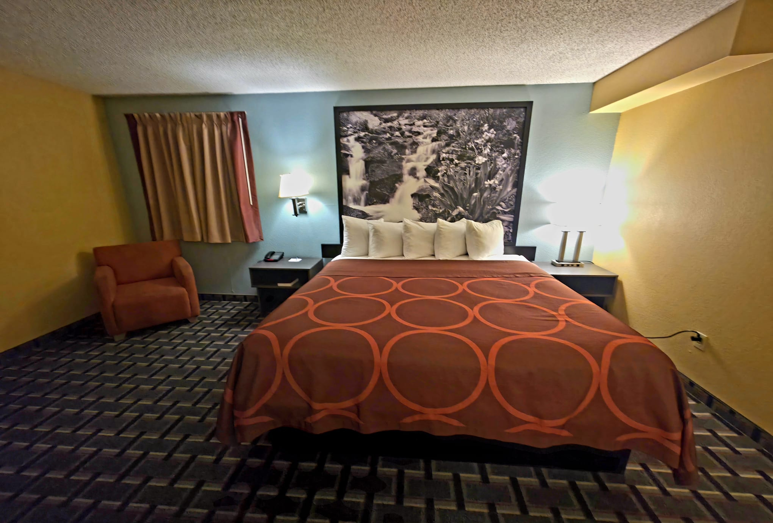 Guest room at the Super 8 by Wyndham Henderson North East Denver in Henderson, Colorado