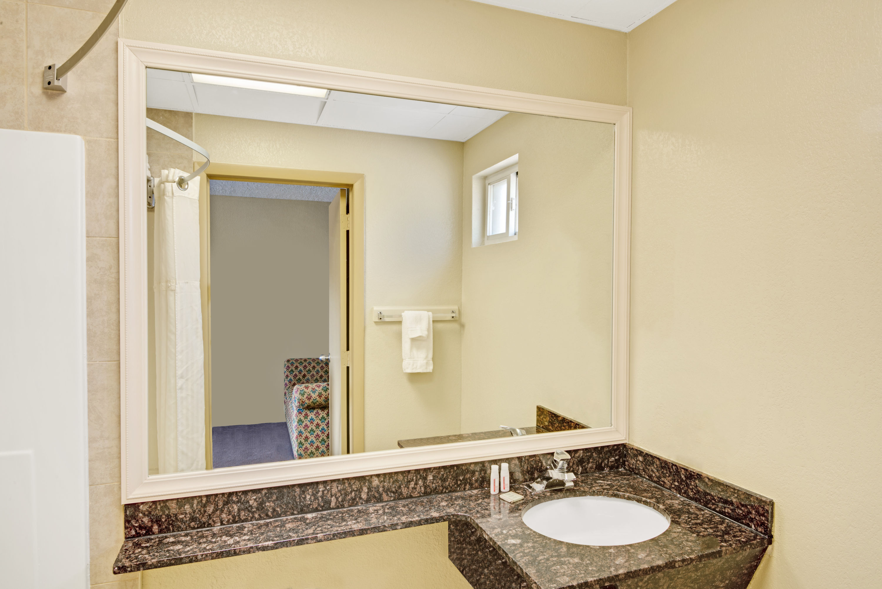 Guest room at the Super 8 by Wyndham Milford/New Haven in Milford, Connecticut