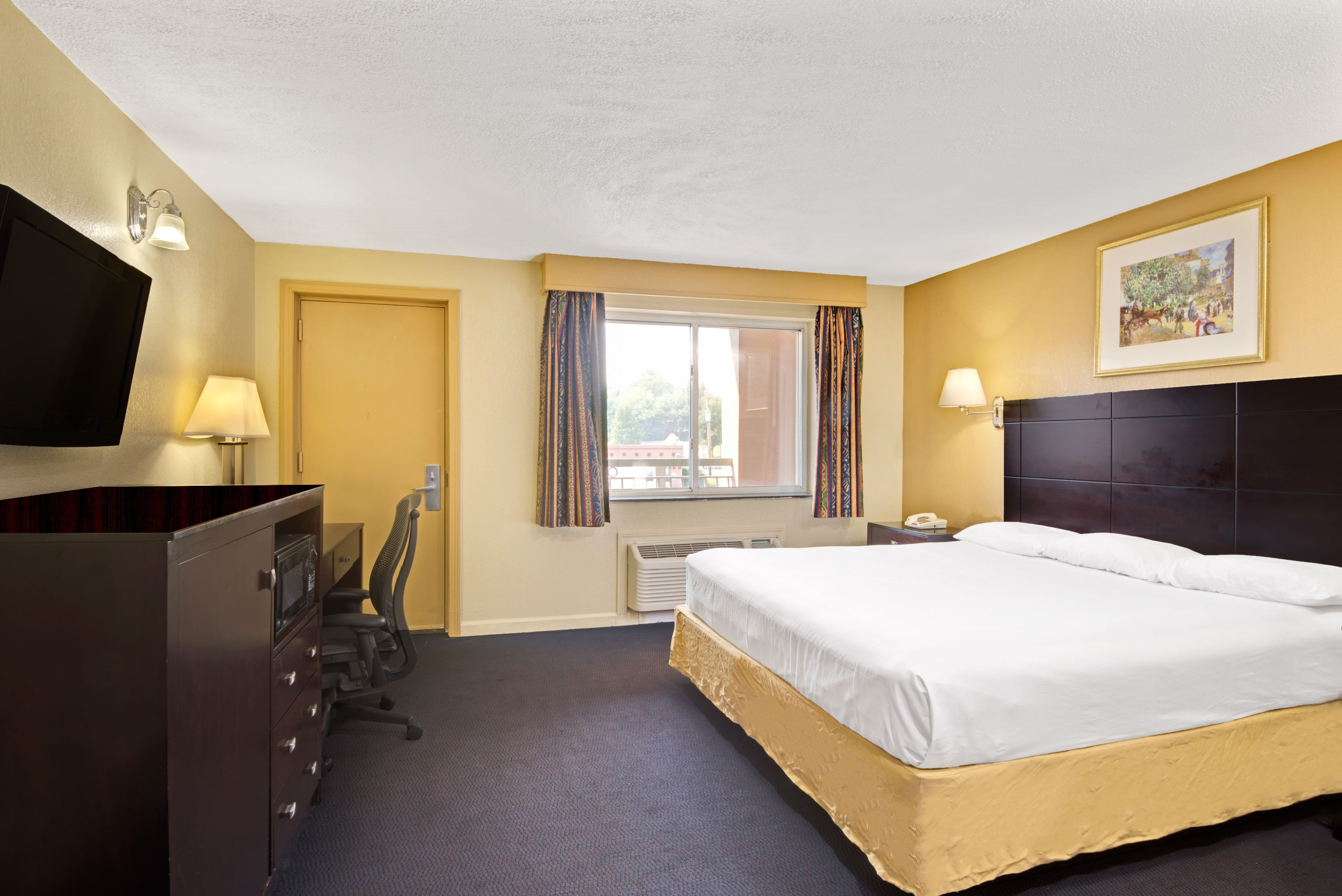 Guest room at the Super 8 by Wyndham Milford/New Haven in Milford, Connecticut