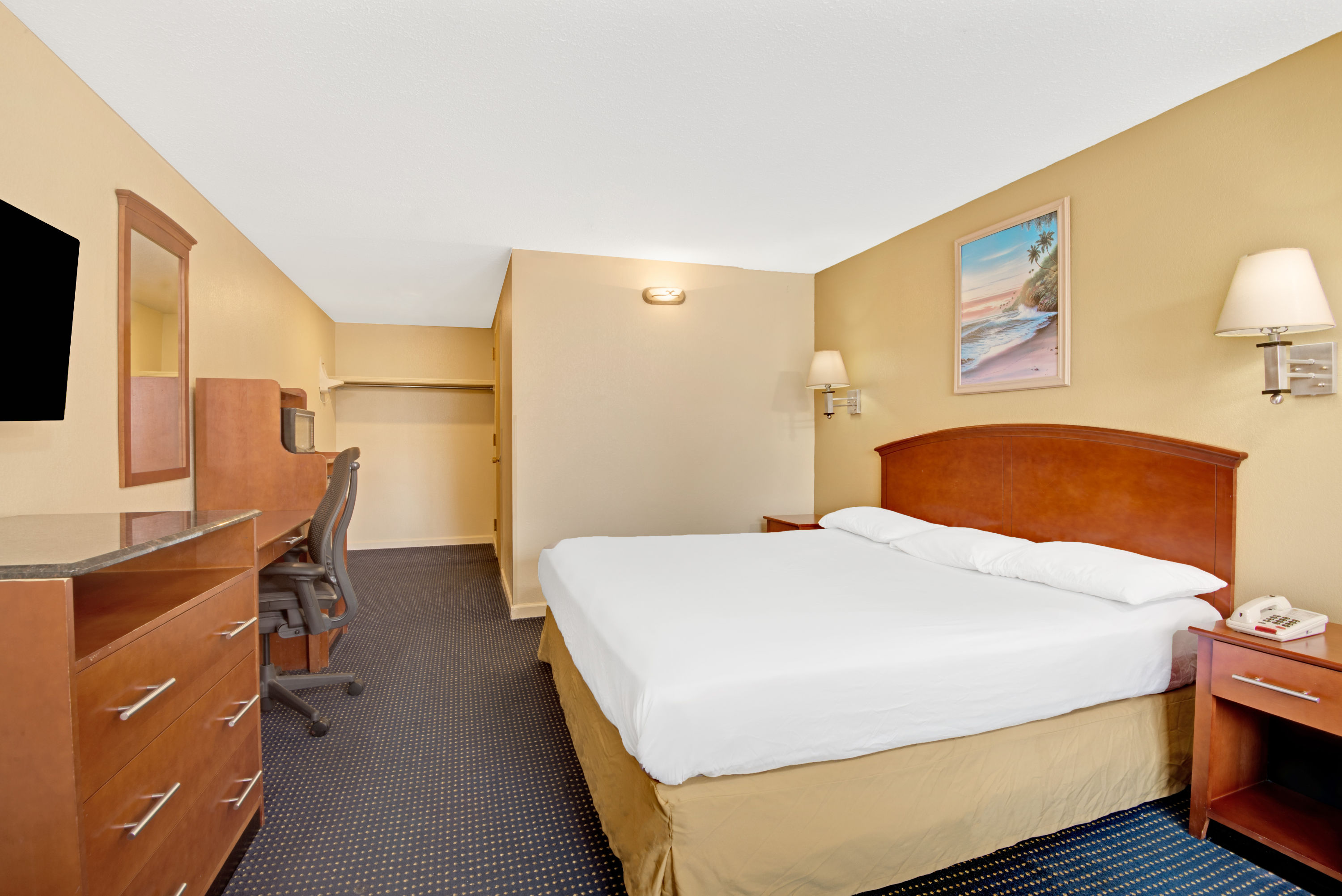 Guest room at the Super 8 by Wyndham Milford/New Haven in Milford, Connecticut
