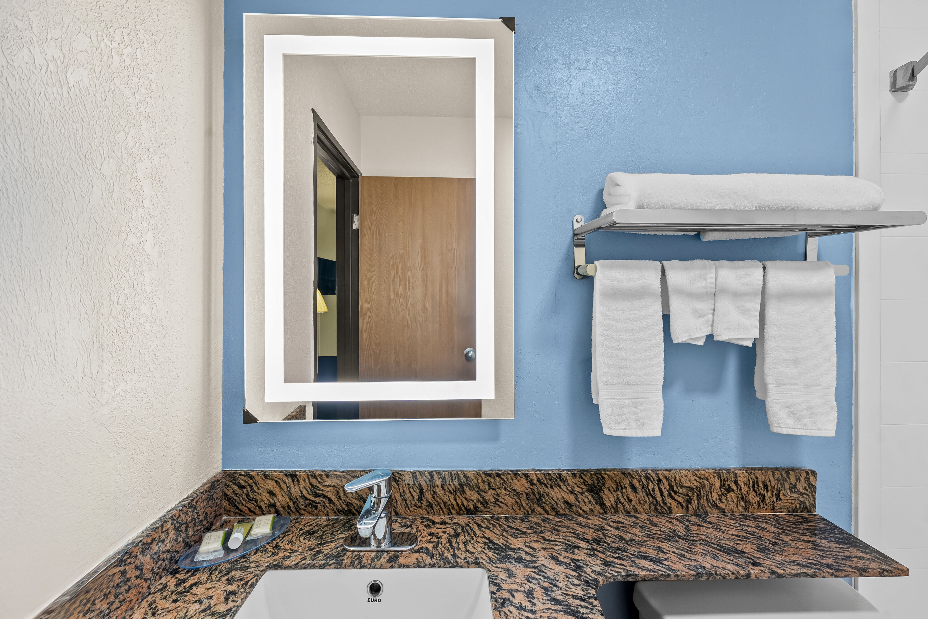 Guest room bath at the Super 8 by Wyndham New Castle in New Castle, Delaware