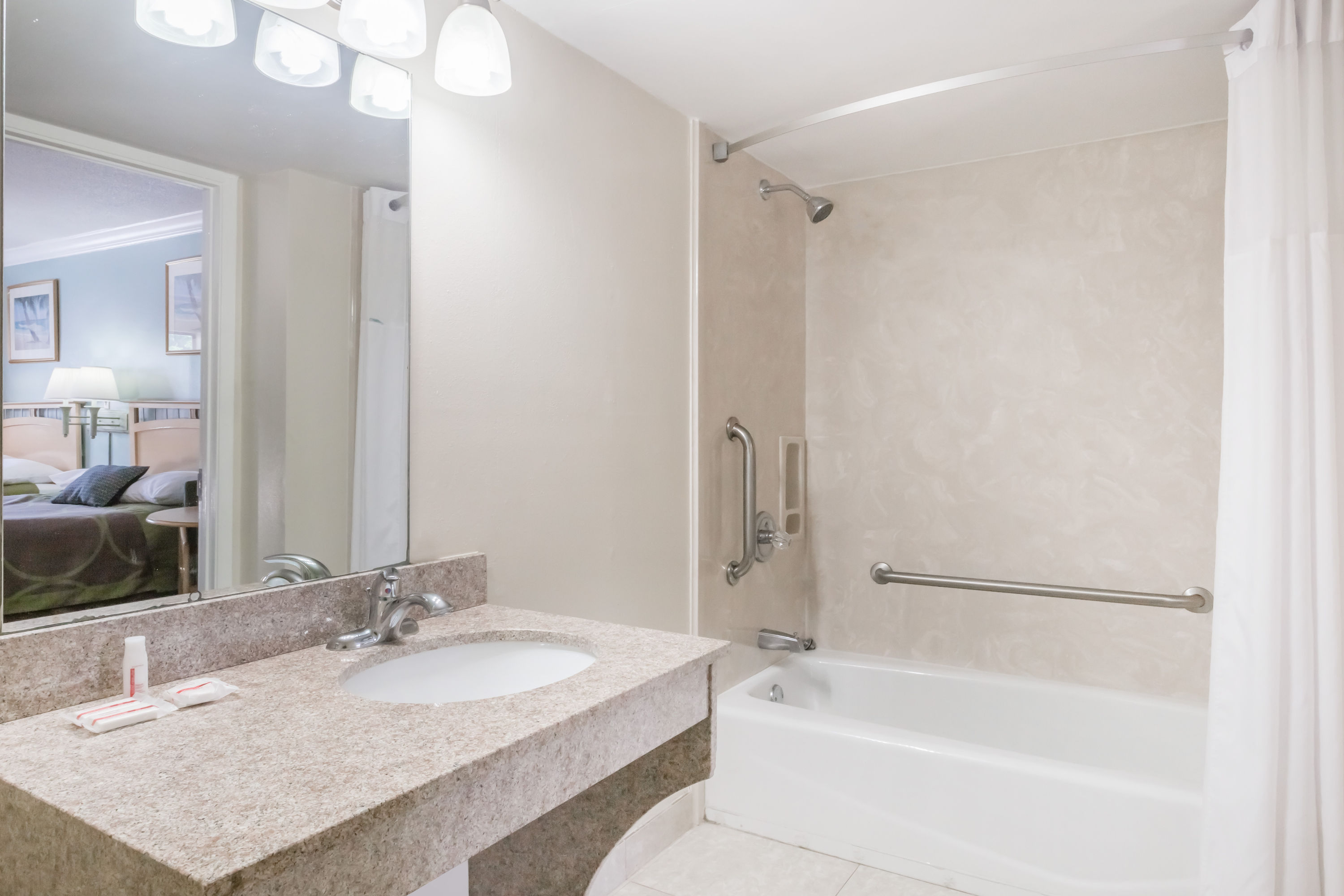 Guest room bath at the Super 8 by Wyndham Ft Walton Beach in Fort Walton Beach, Florida