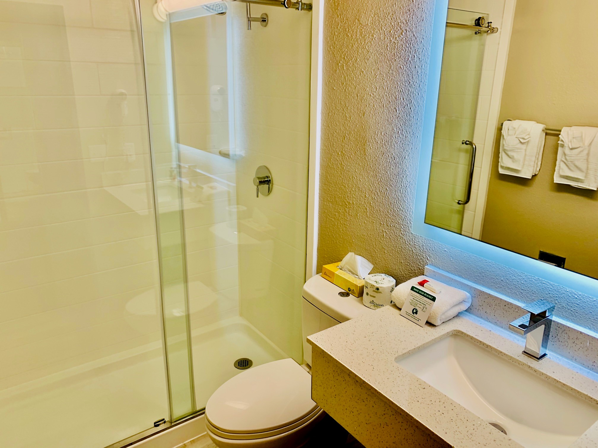 Guest room bath at the Super 8 by Wyndham Gainesville I-75 Hospital/University Area in Gainesville, Florida