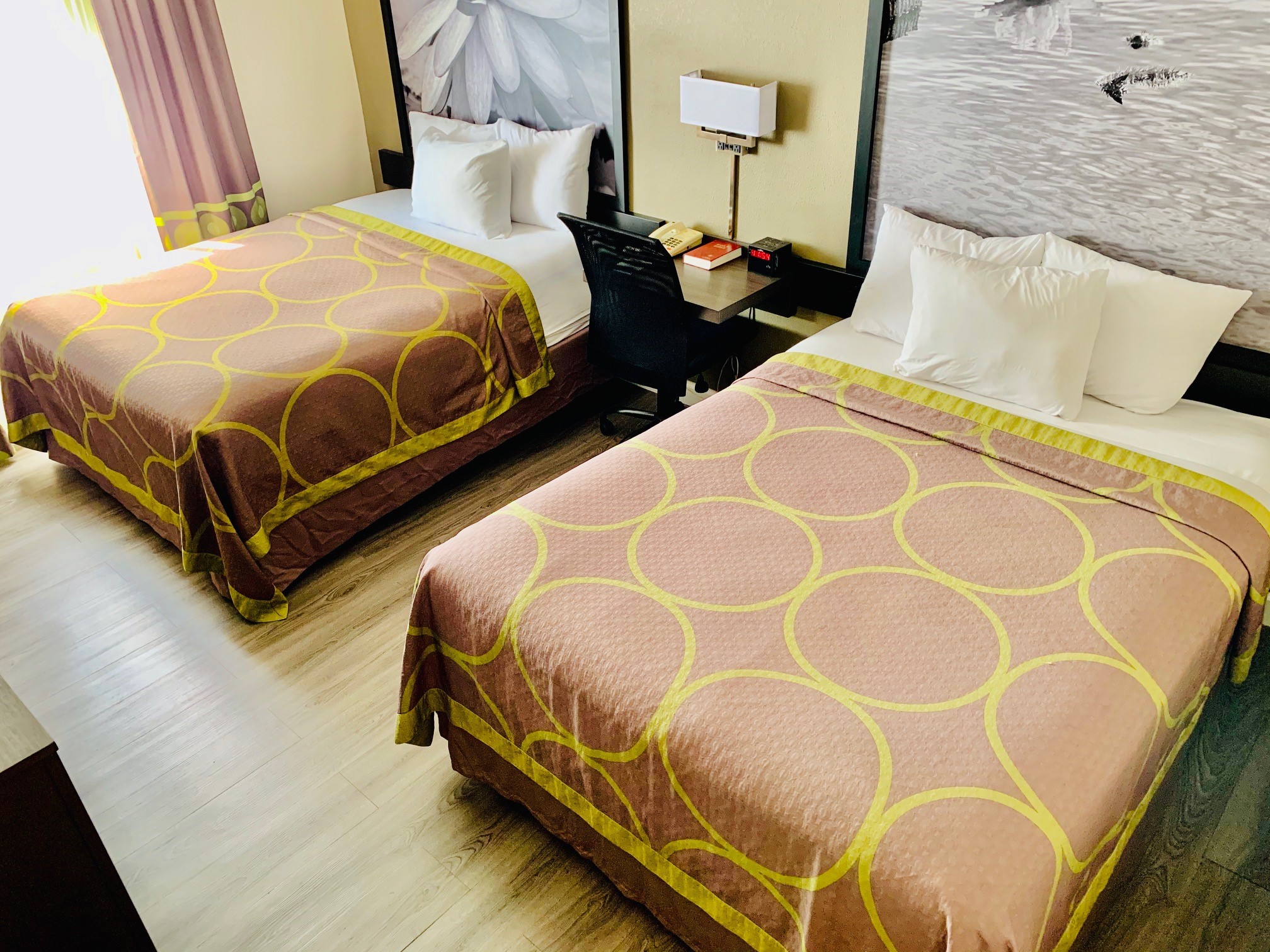 Guest room at the Super 8 by Wyndham Gainesville I-75 Hospital/University Area in Gainesville, Florida