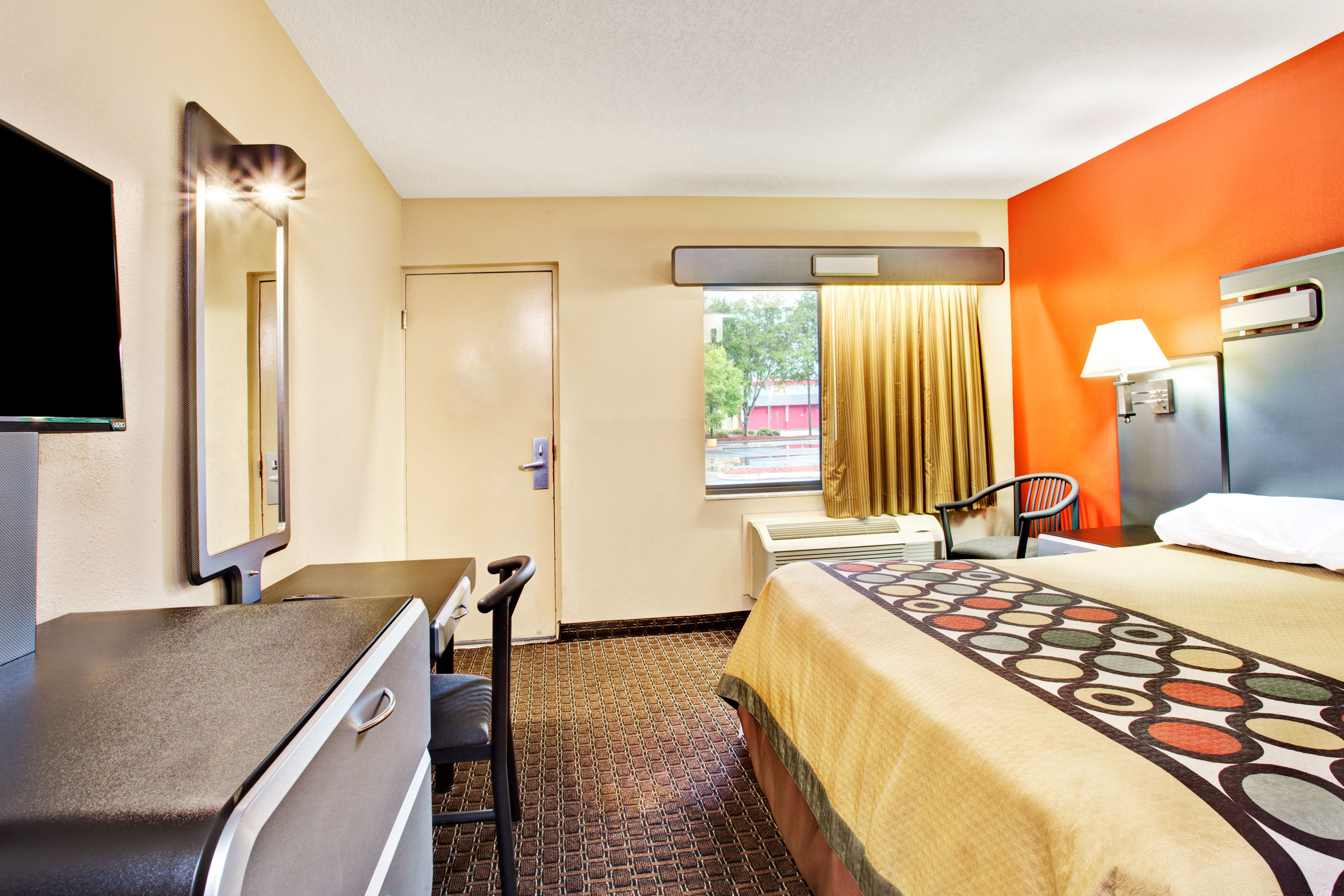 Guest room at the Super 8 by Wyndham Kissimmee/Maingate/Orlando Area in Kissimmee, Florida