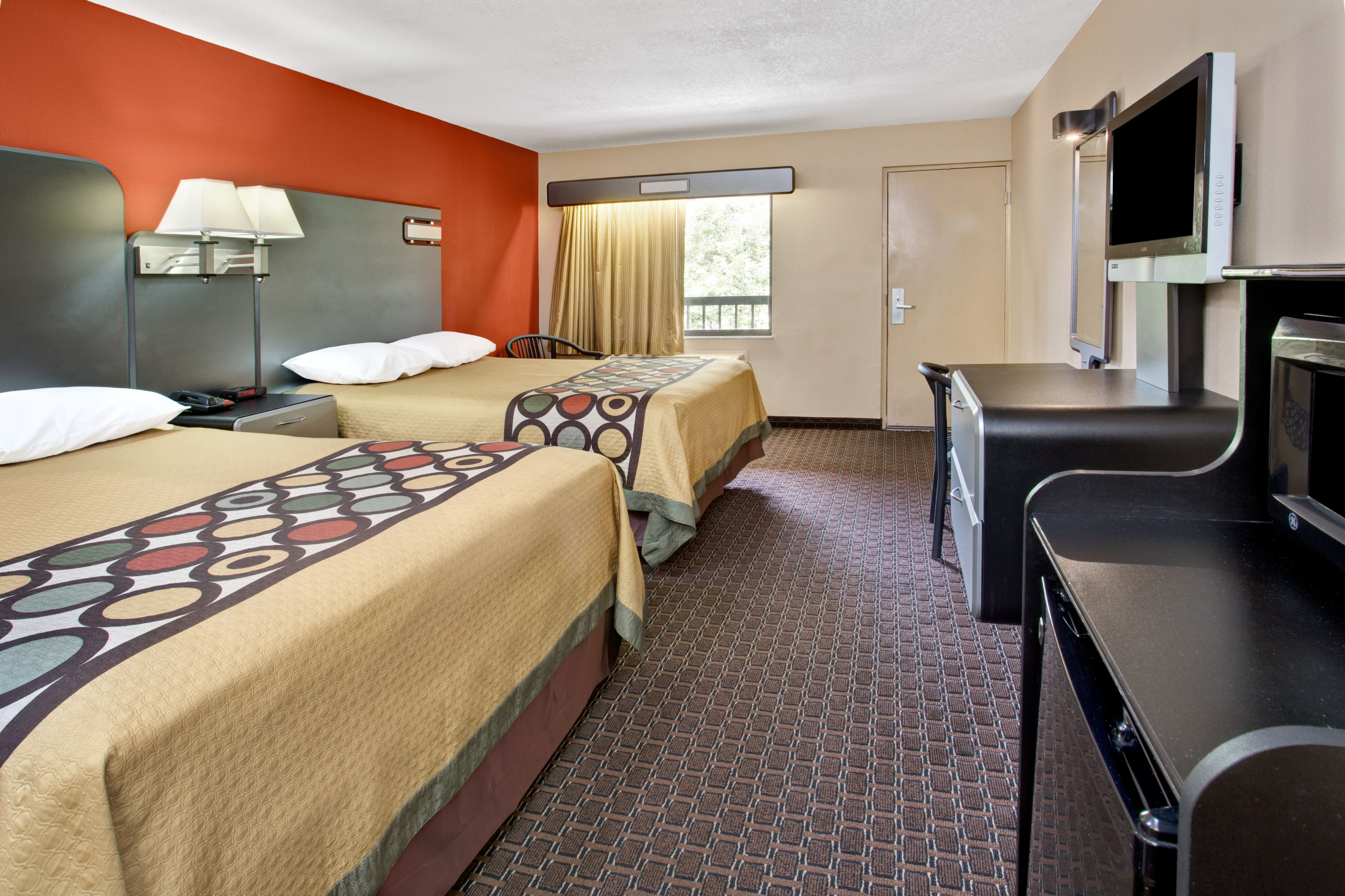 Guest room at the Super 8 by Wyndham Kissimmee/Maingate/Orlando Area in Kissimmee, Florida