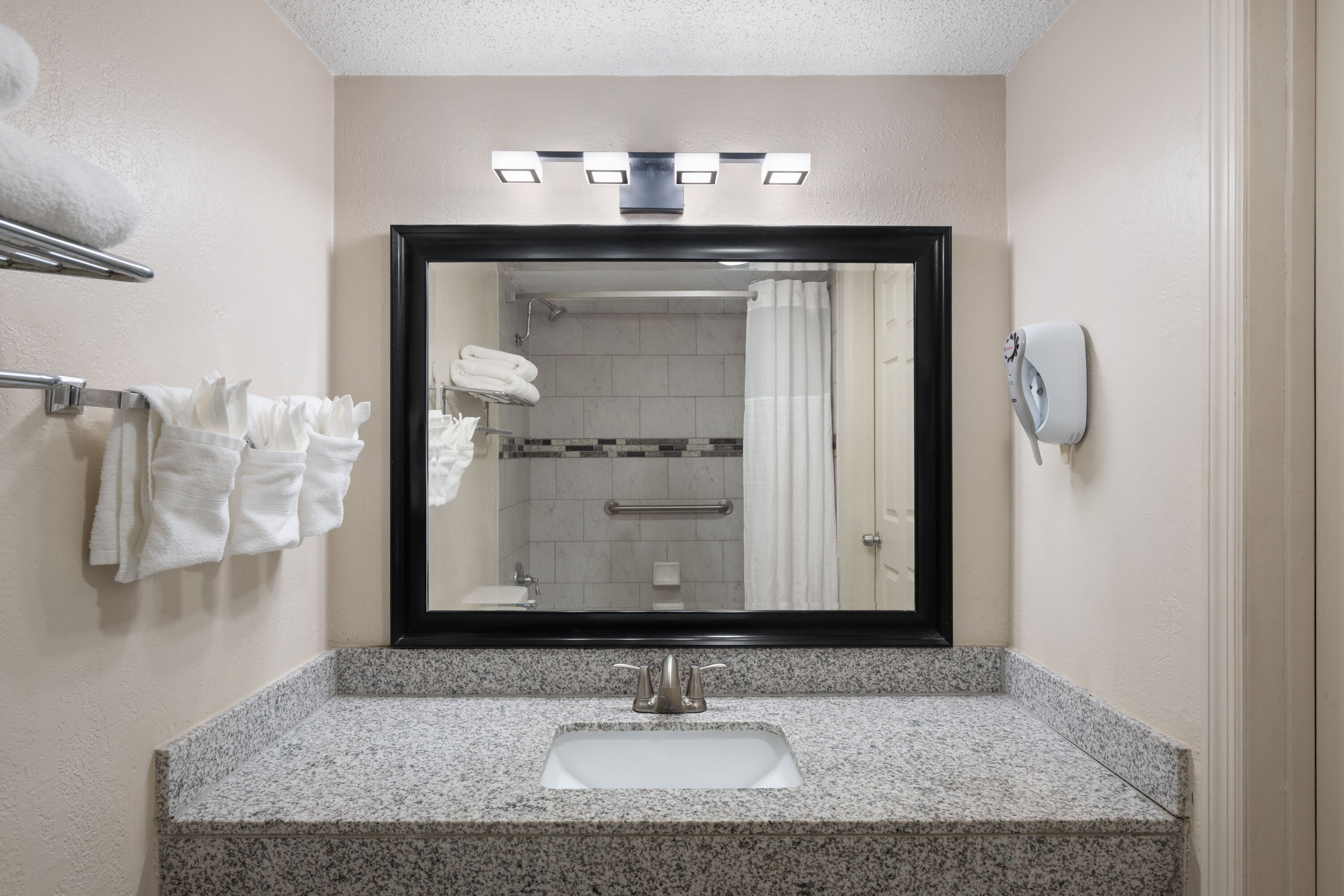 Guest room bath at the Super 8 by Wyndham Lake City in Lake City, Florida