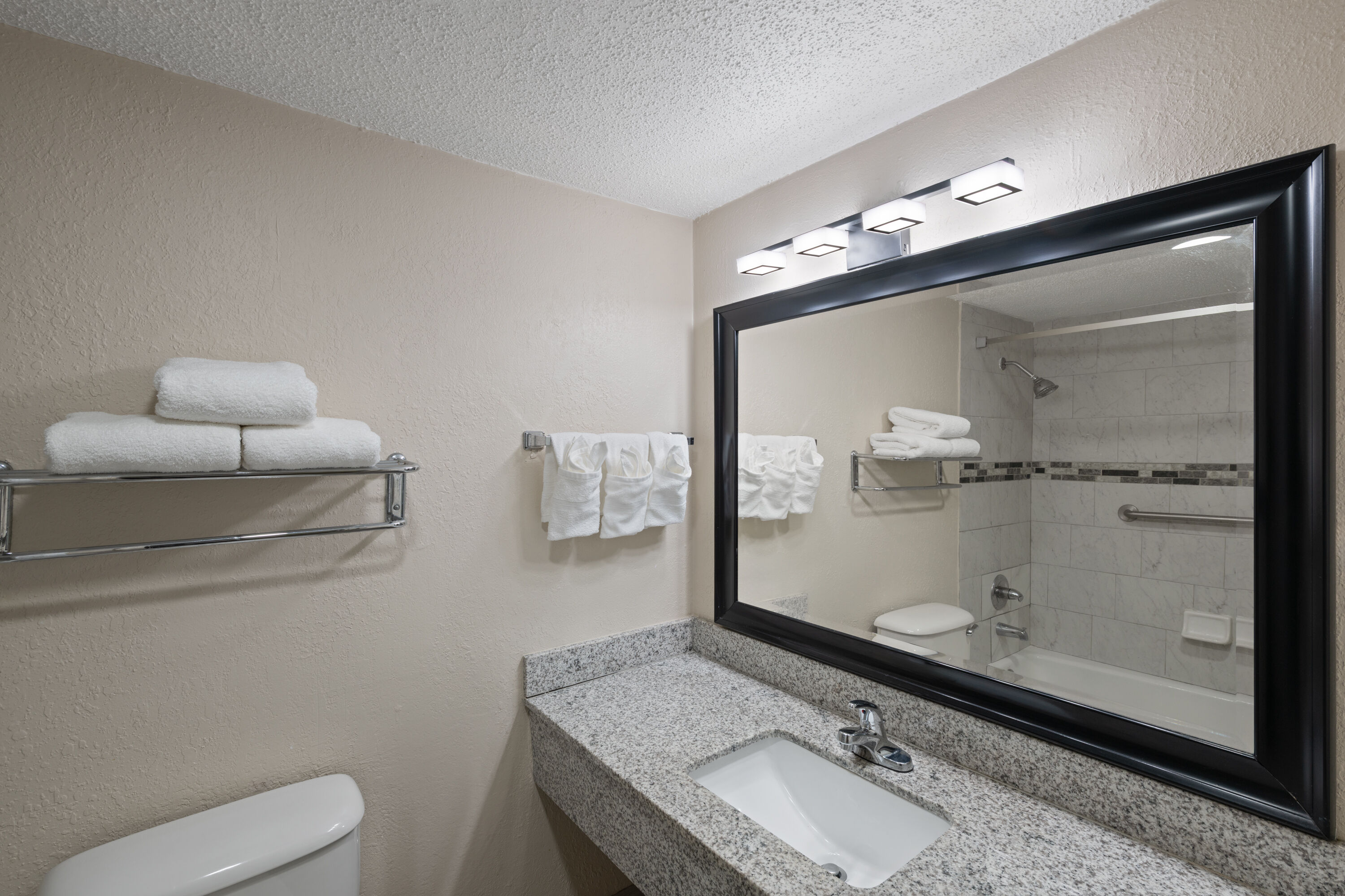 Guest room bath at the Super 8 by Wyndham Lake City in Lake City, Florida