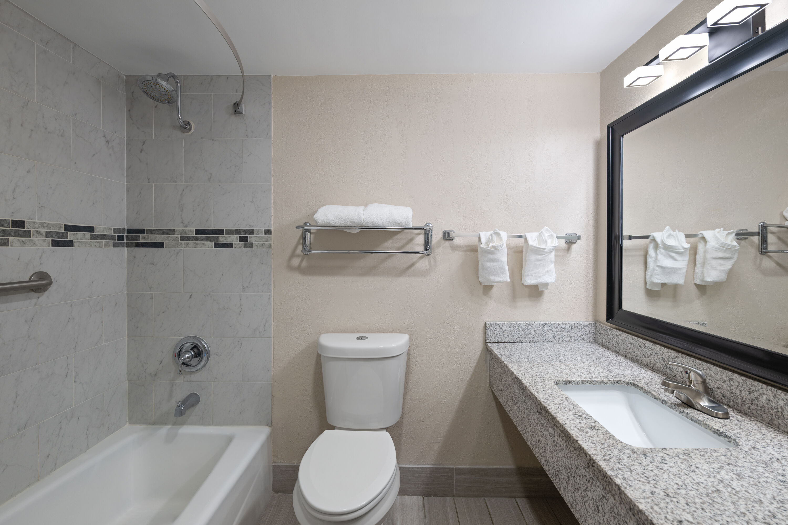 Guest room bath at the Super 8 by Wyndham Lake City in Lake City, Florida