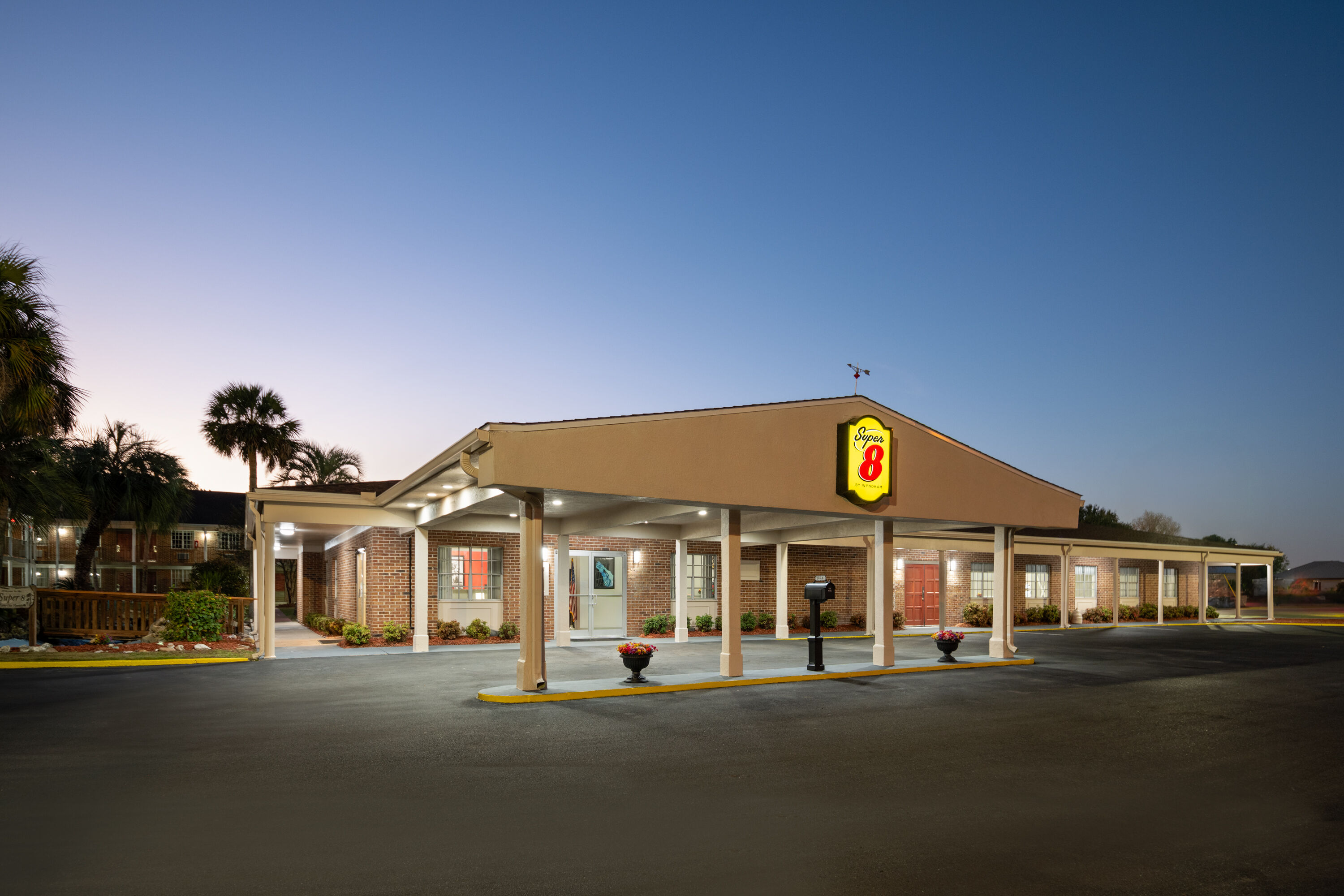 Exterior Dusk Image of Super 8 by Wyndham Lake City hotel in Lake City, Florida