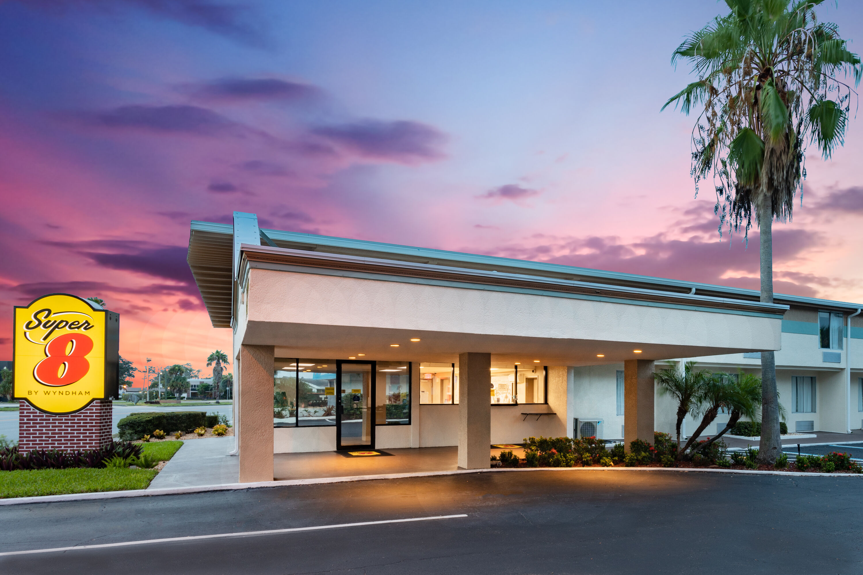 Exterior Dusk Image of Super 8 by Wyndham Melbourne hotel in Melbourne, Florida