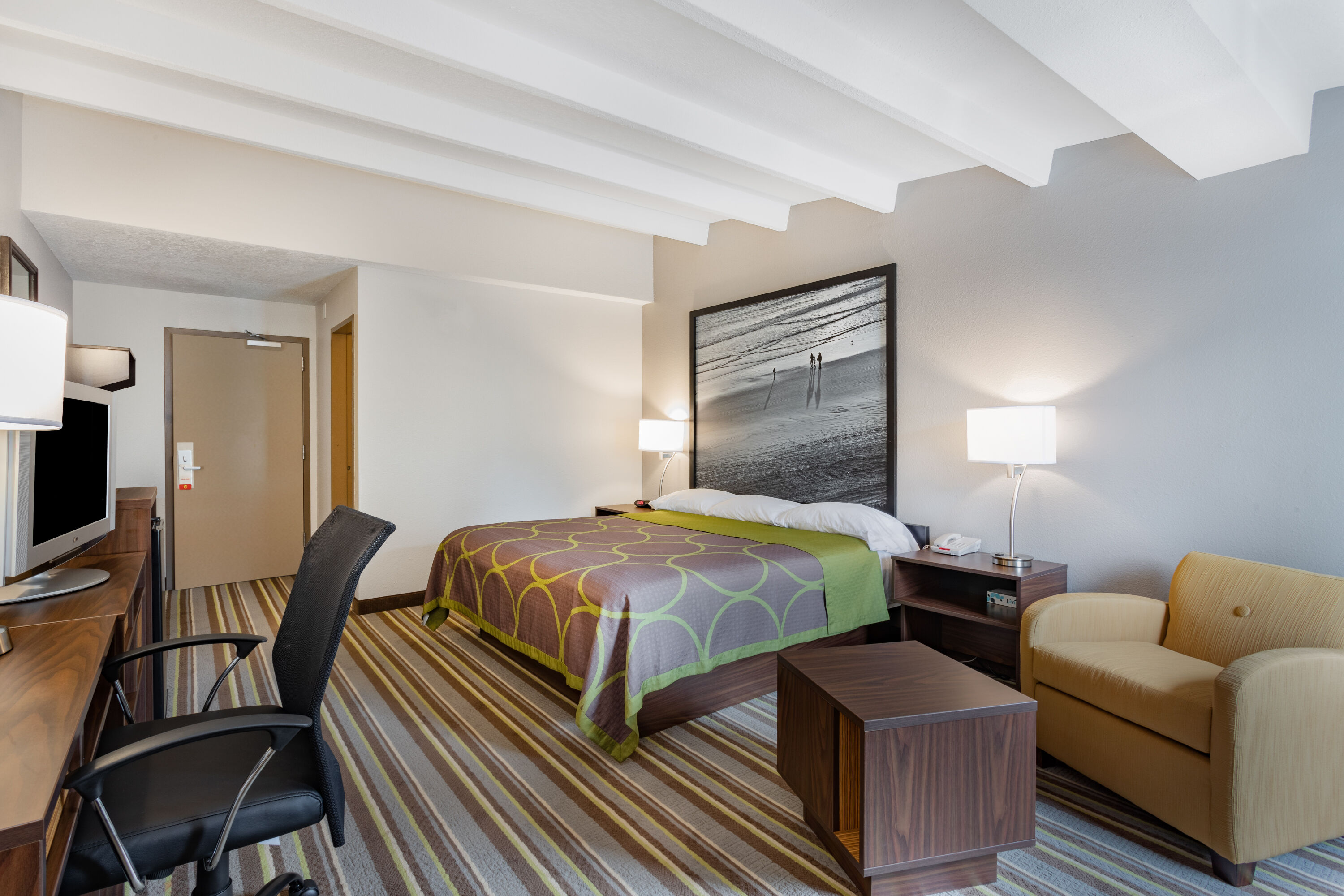 Guest room at the Super 8 by Wyndham Melbourne in Melbourne, Florida