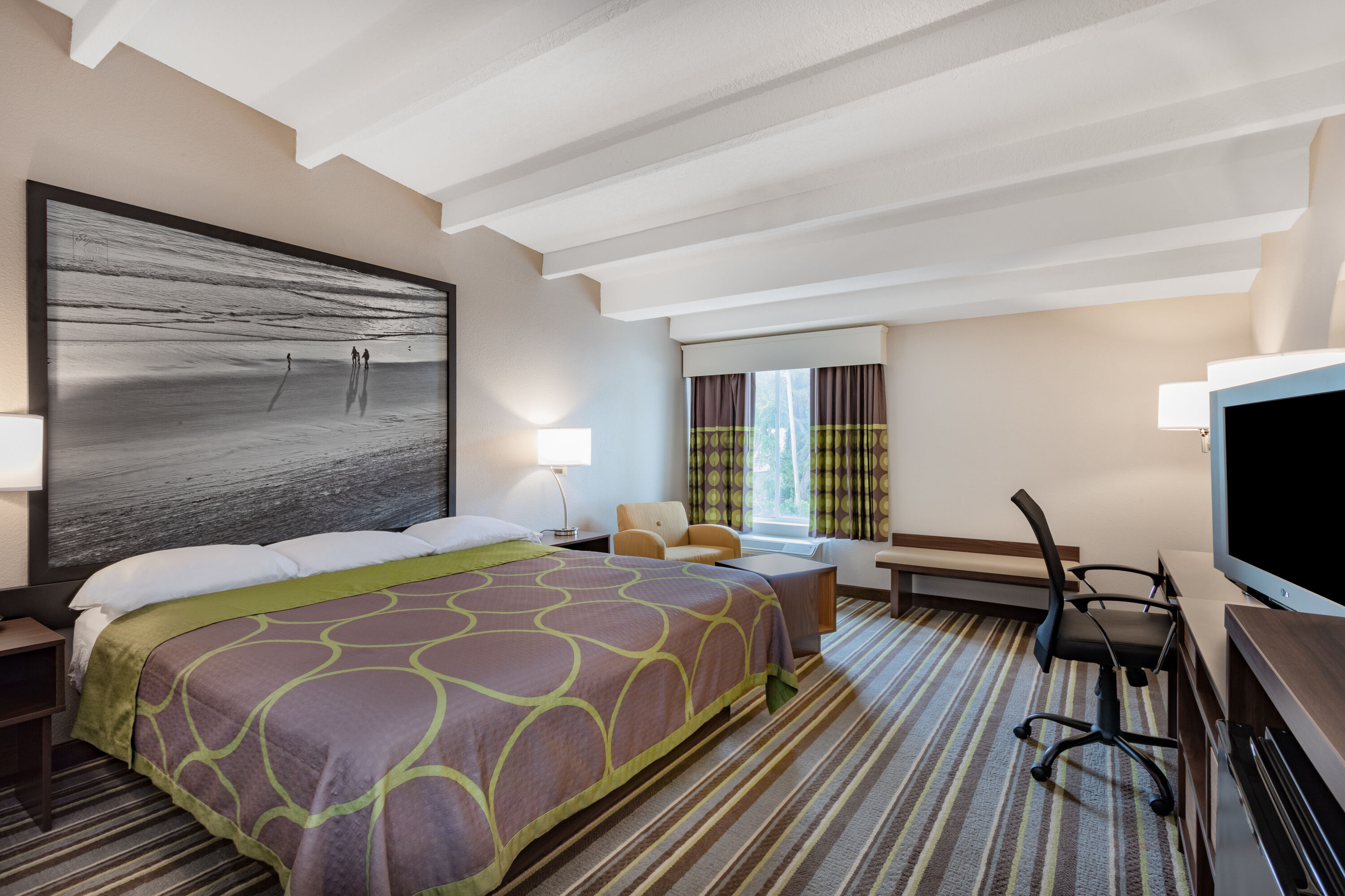 Guest room at the Super 8 by Wyndham Melbourne in Melbourne, Florida