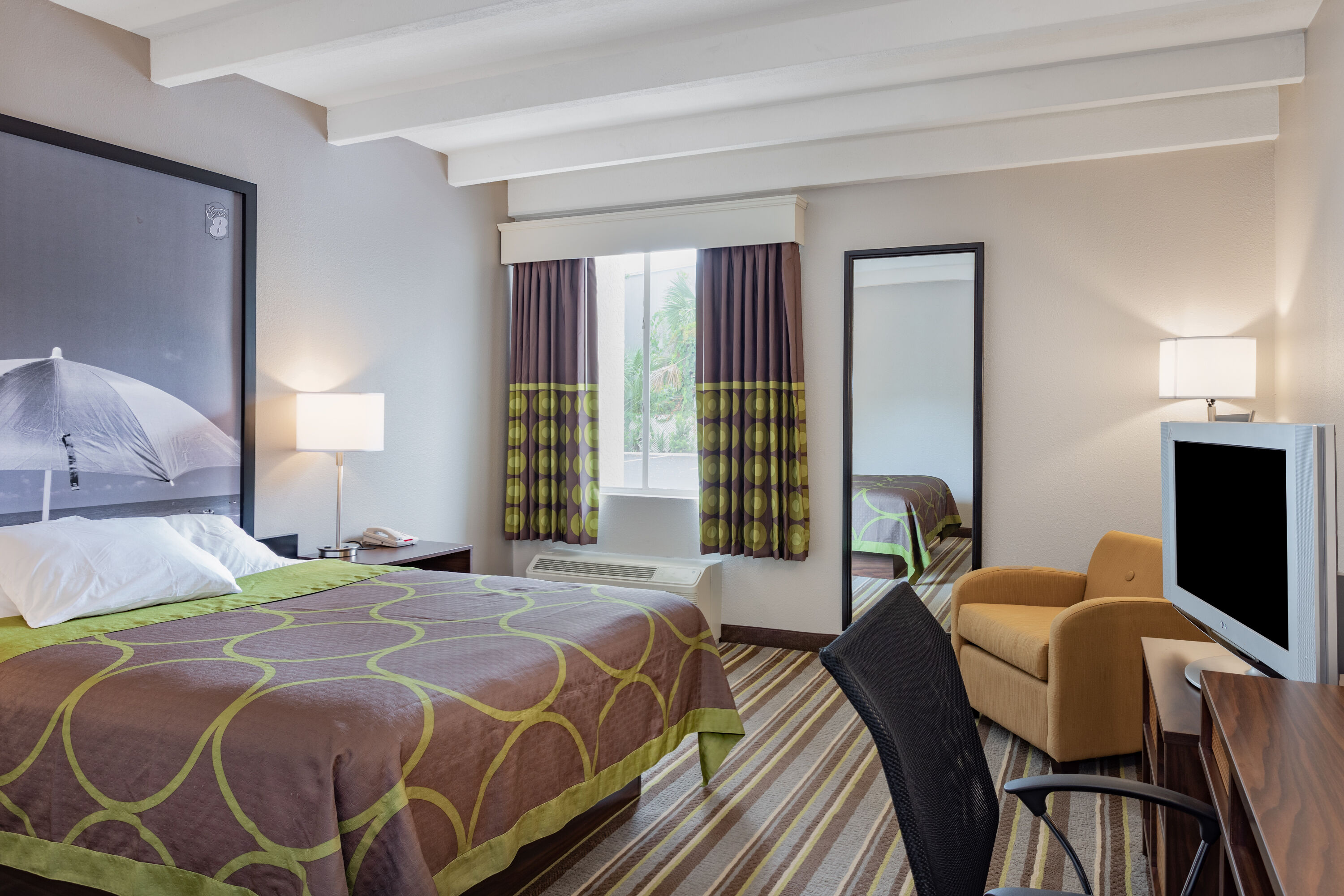 Guest room at the Super 8 by Wyndham Melbourne in Melbourne, Florida