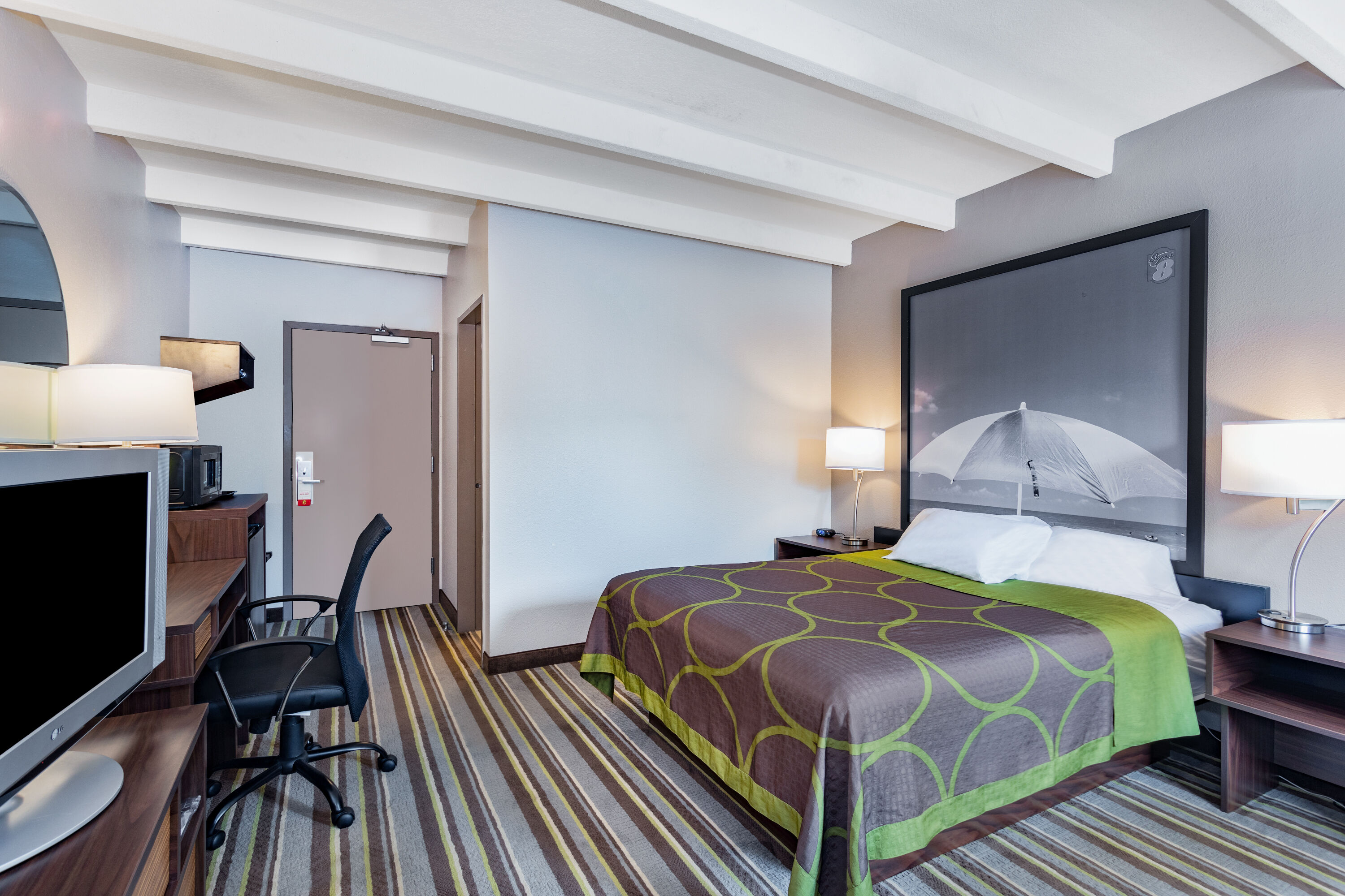 Guest room at the Super 8 by Wyndham Melbourne in Melbourne, Florida